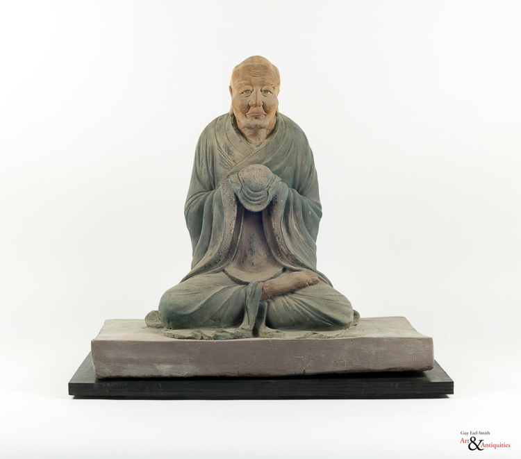A Painted Clay Ming Dynasty Sculpture Of A Luohan, c. 1368-1645