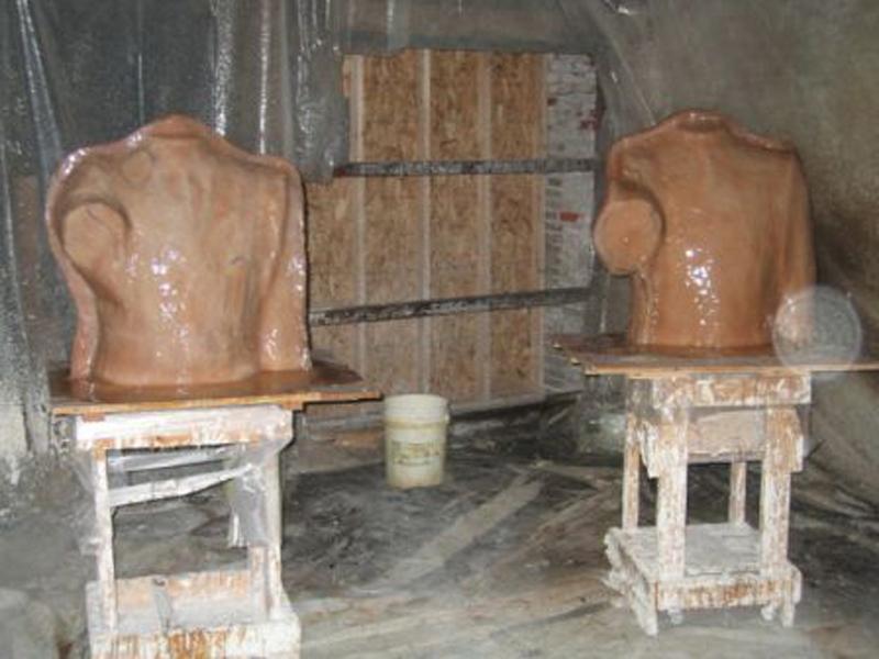 Rubber molds are painted on the clay.