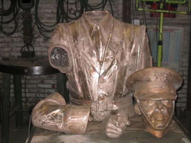 Bronze parts are welded together.