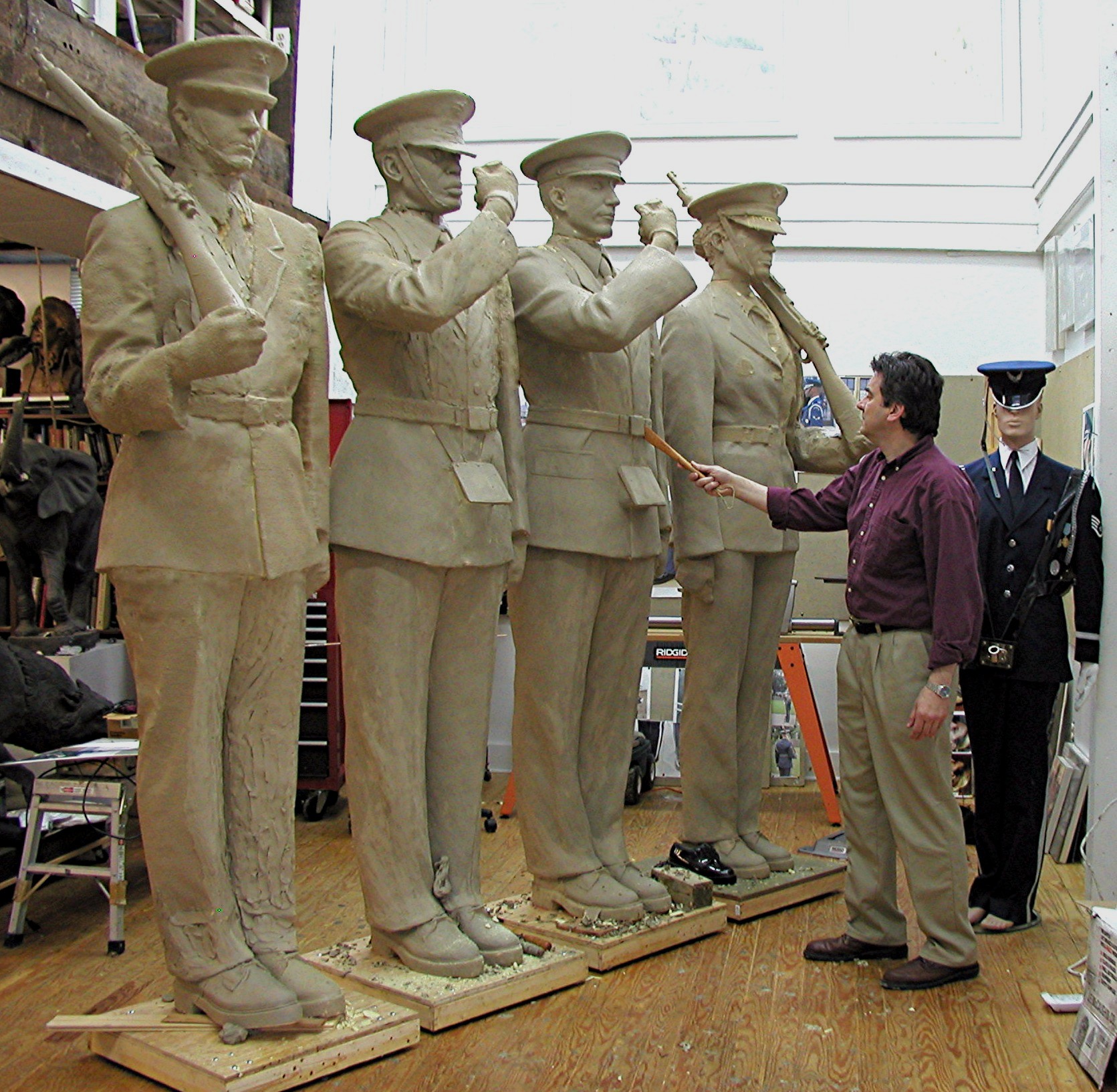 The sculpture is completed in clay.