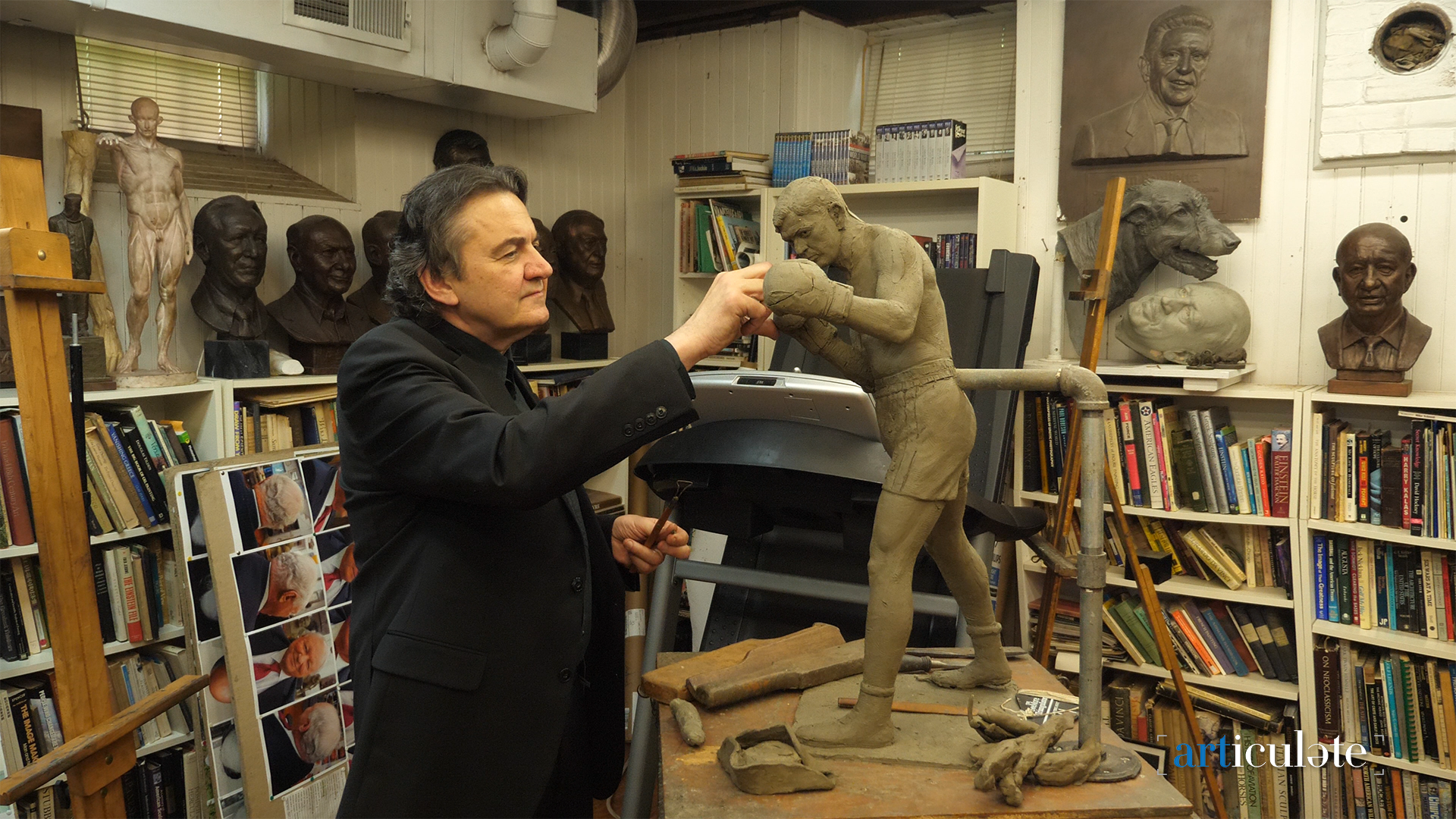  Sculptor Zenos in Frudakis Studio shown working on Braddock sculpture. 