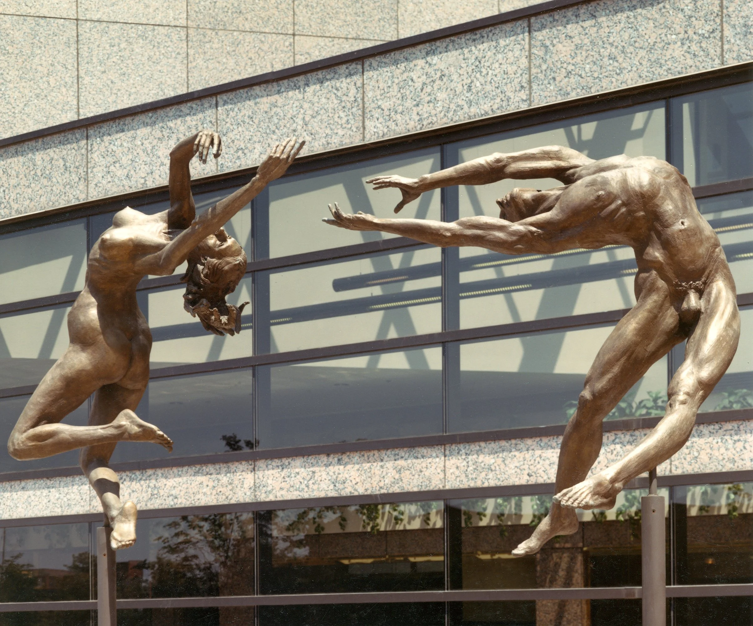 Reaching - bronze figure sculpture by master sculptor Zenos Frudakis. Sculpture is of two figures, a woman and man, reaching for each other.