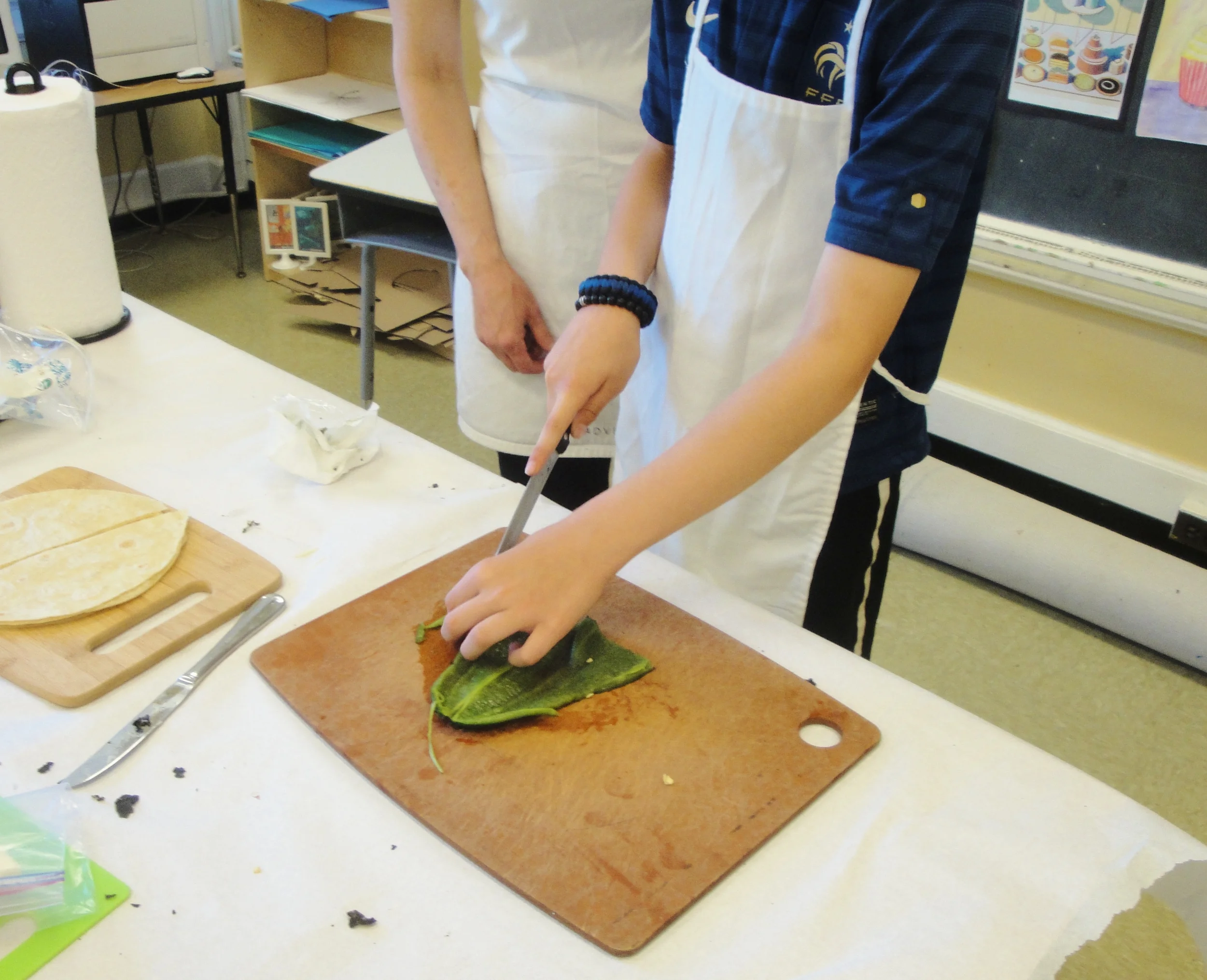 Cutting the Poblano chile into strips