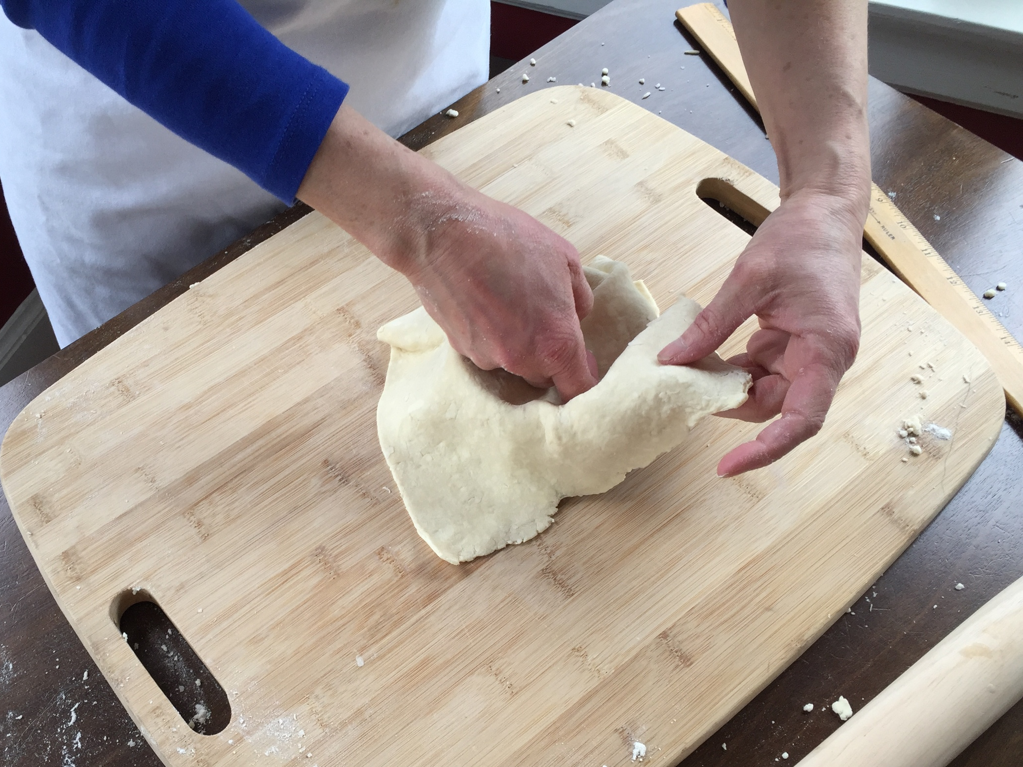 Fitting the pate brisee into the pan