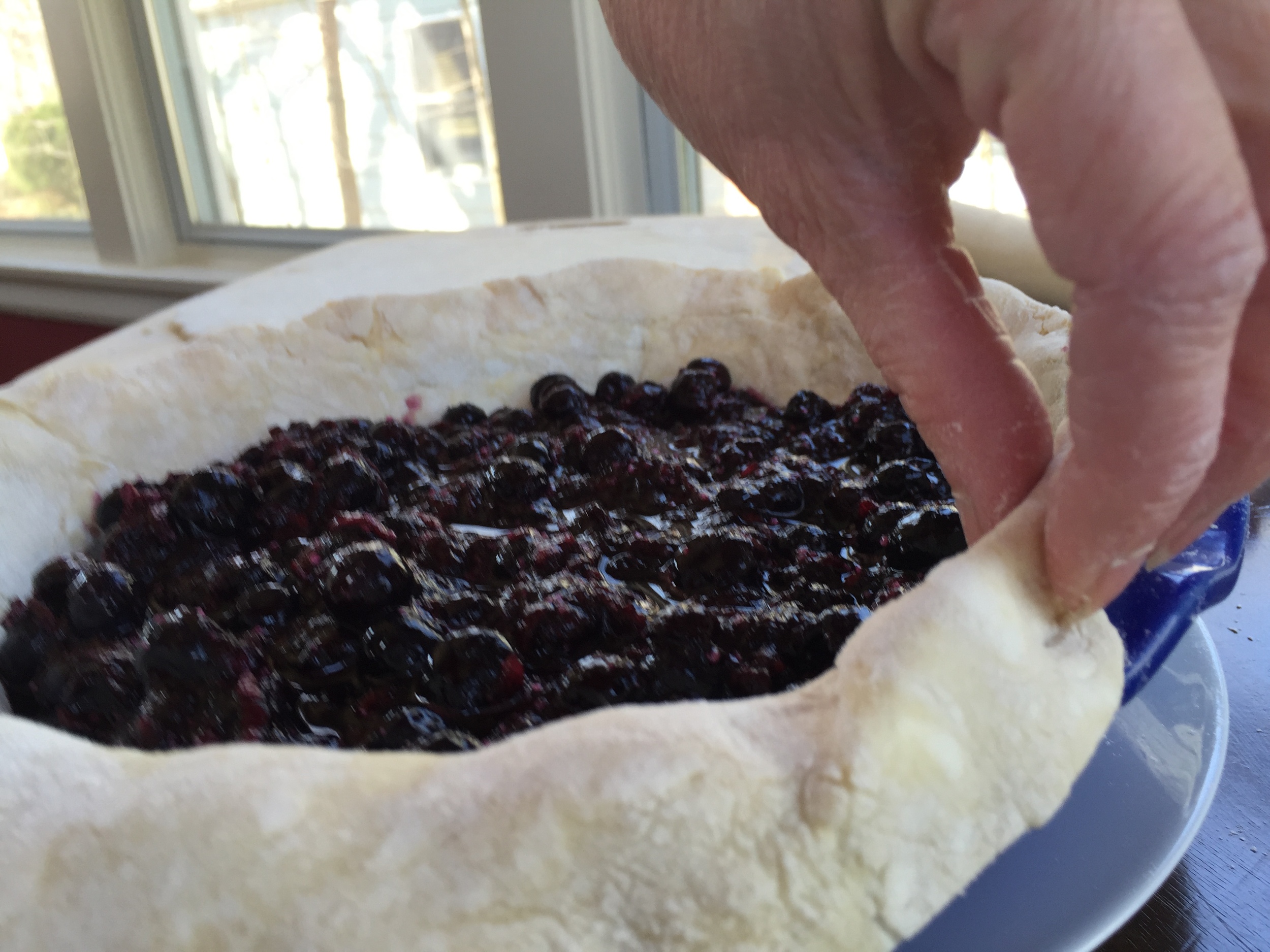 Folding the extra pastry back.