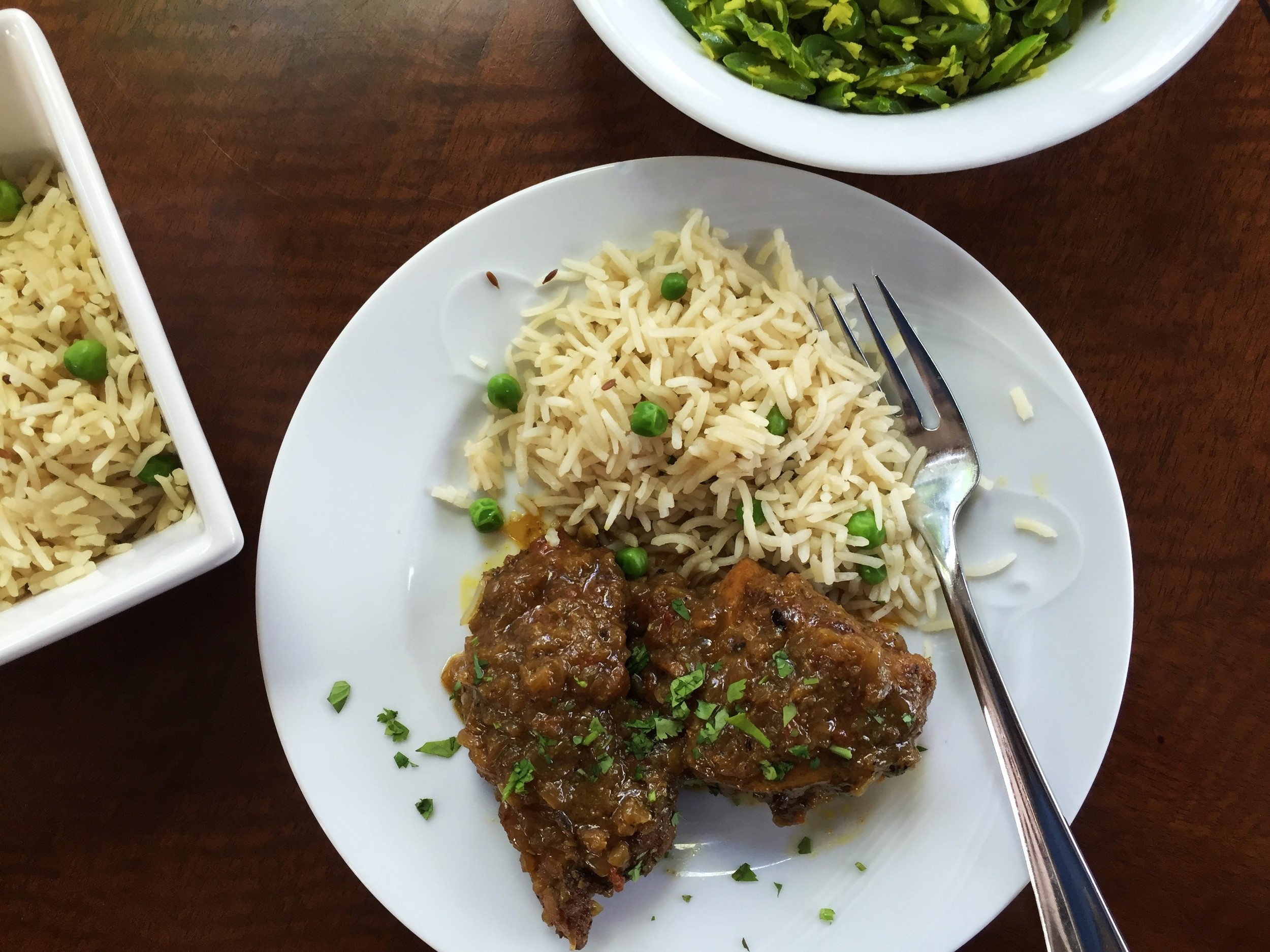 Muglai Indian Chicken Curry in the Adventure Kitchen, shown with South Indian Vegetable Curry and Jeera Fried Rice .