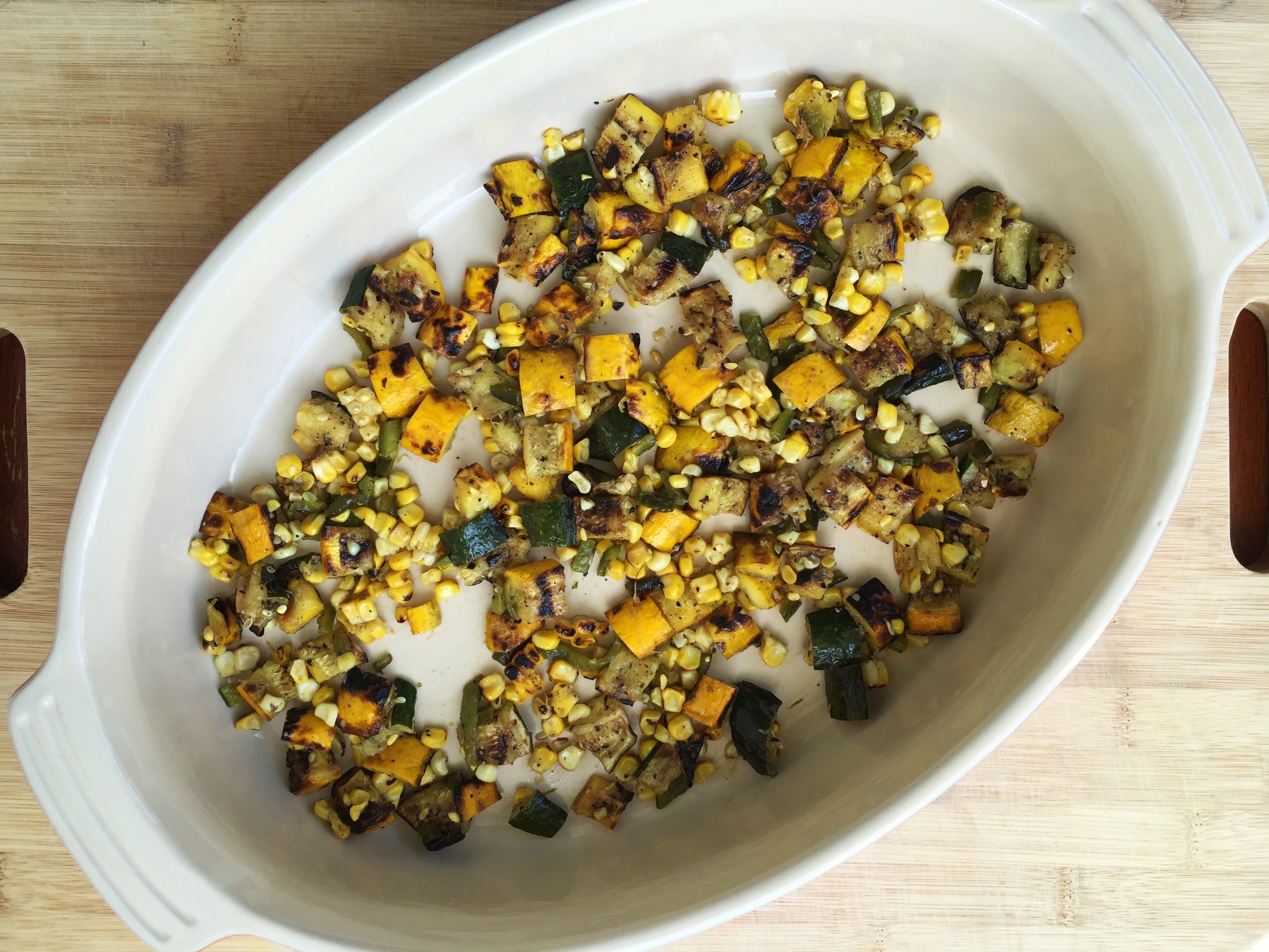 Thin layer of vegetables in the bottom of the baking dish.