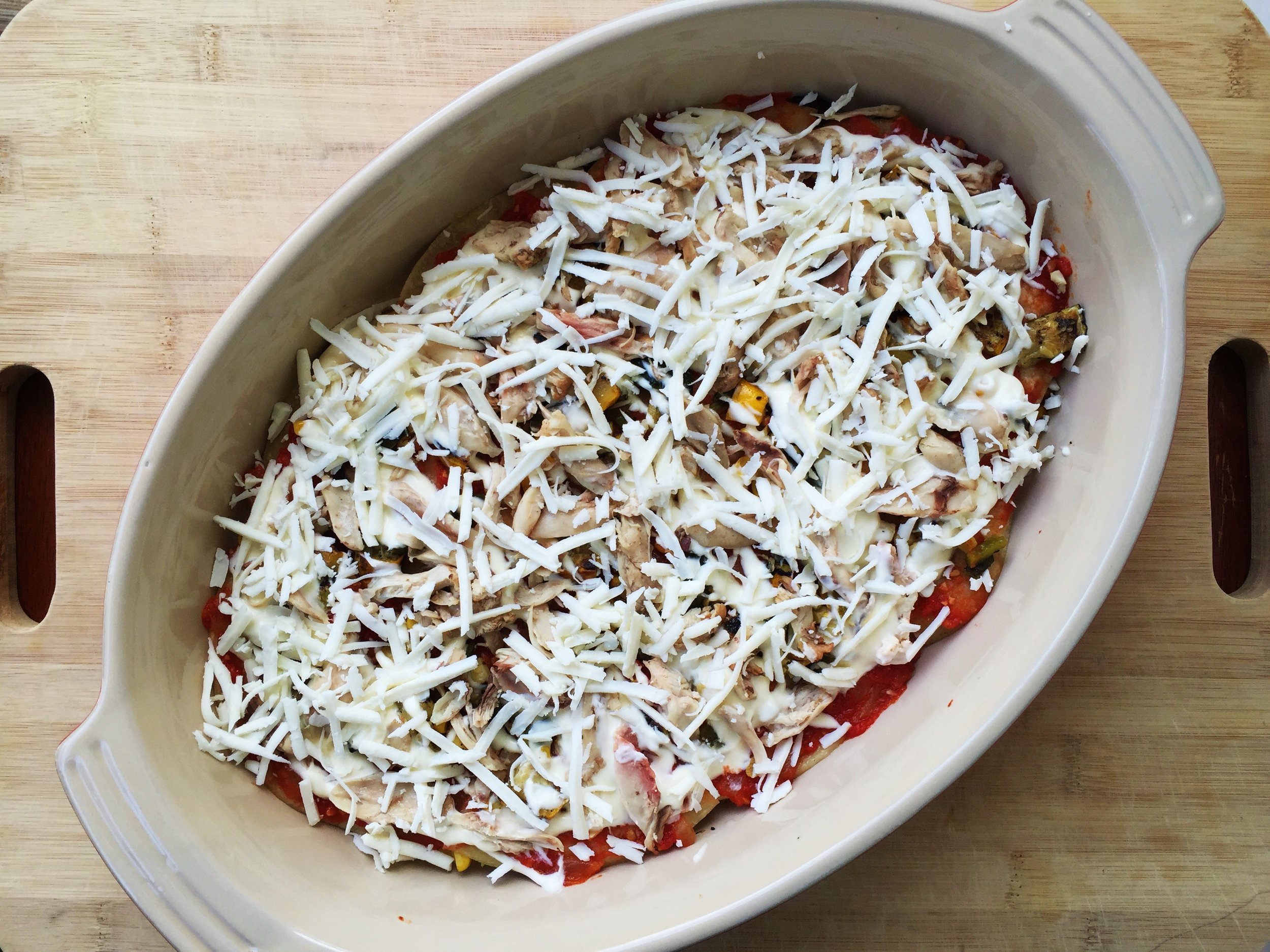 One-third of the cheese spread over the other ingredients.