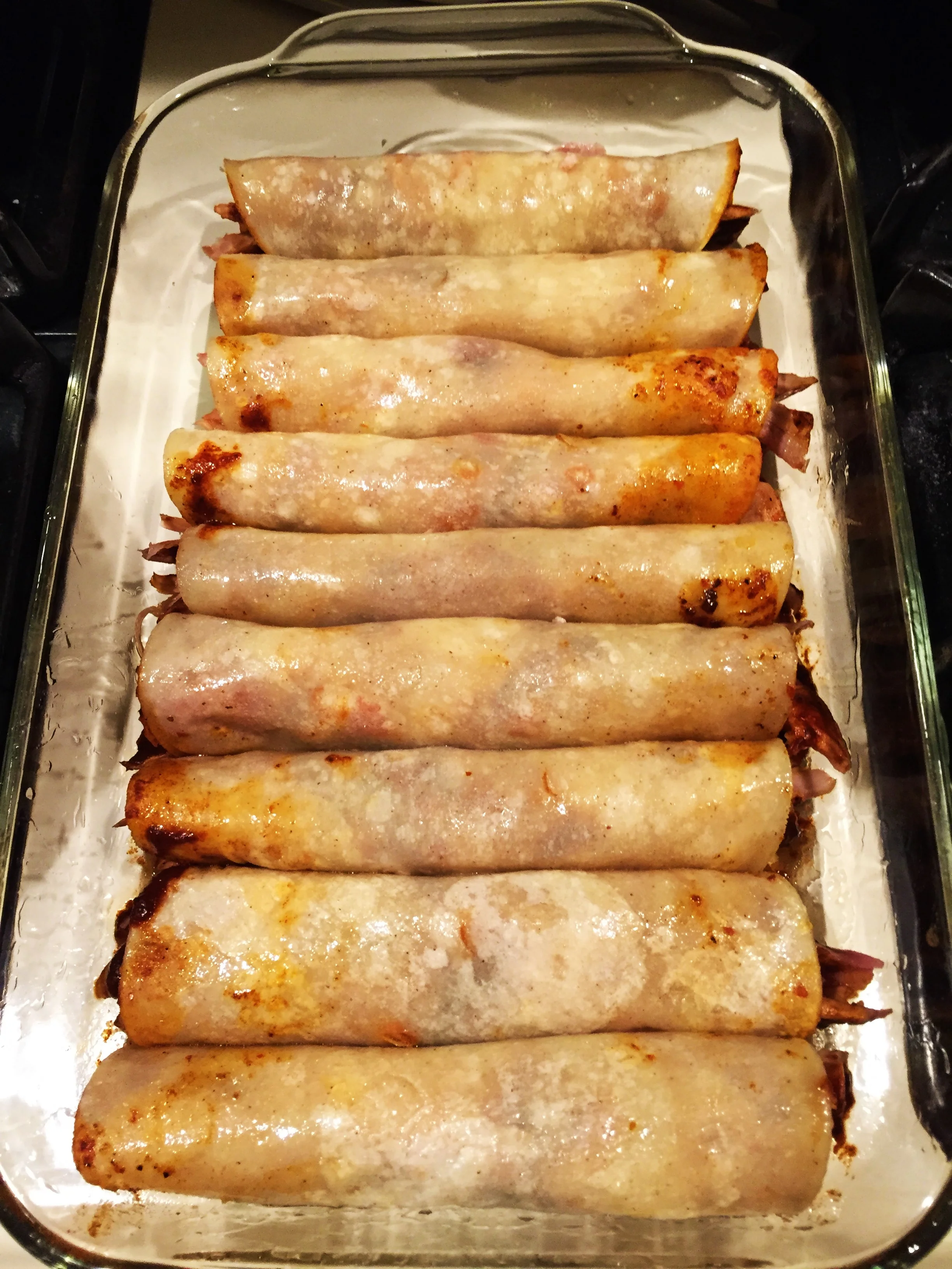 Enchiladas, all rolled up and ready for sauce and cheese.