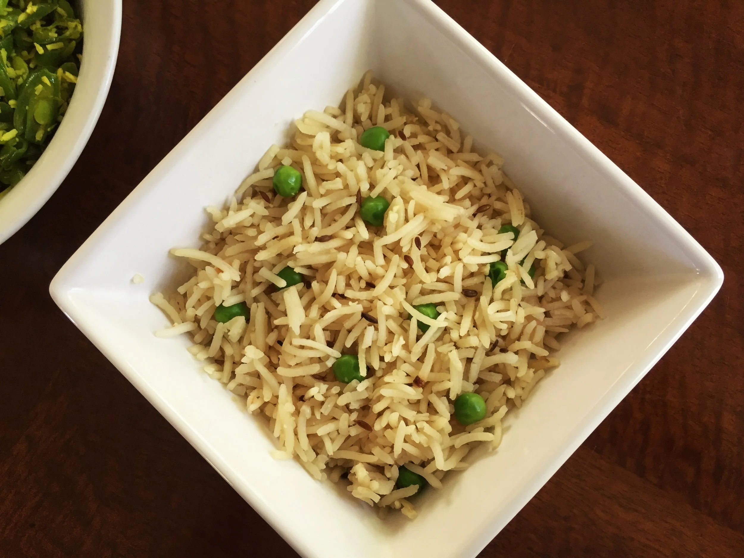 Jeera Fried Rice in the Adventure Kitchen, shown with South Indian Vegetable Curry .