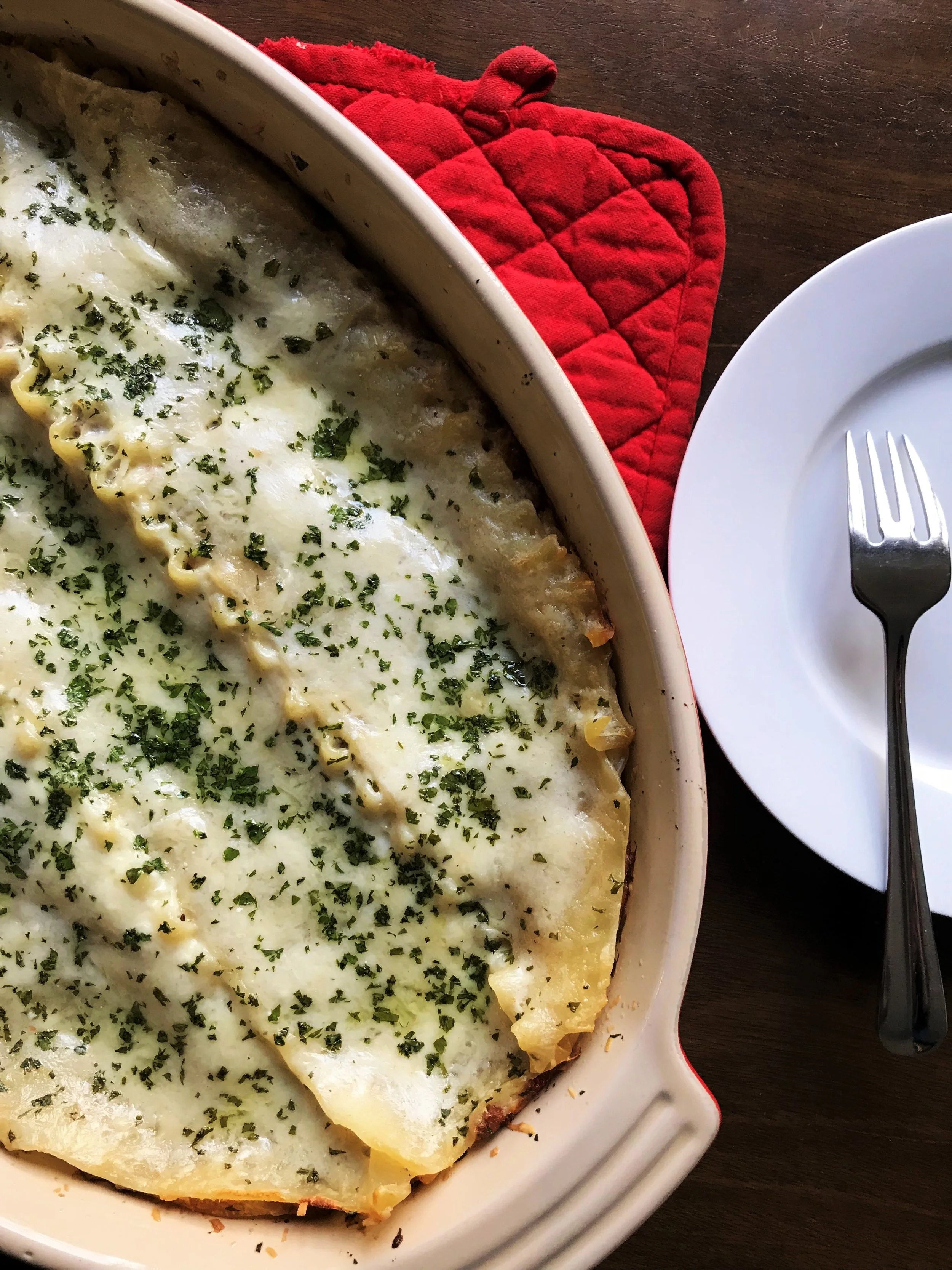 Classic Lasagna, made with Bolognese sauce and Parmesan bechamel in the Adventure Kitchen, with a sprinkle of pecorino Romano and parsley. Plan ahead to make the Bolognese sauce the day before.