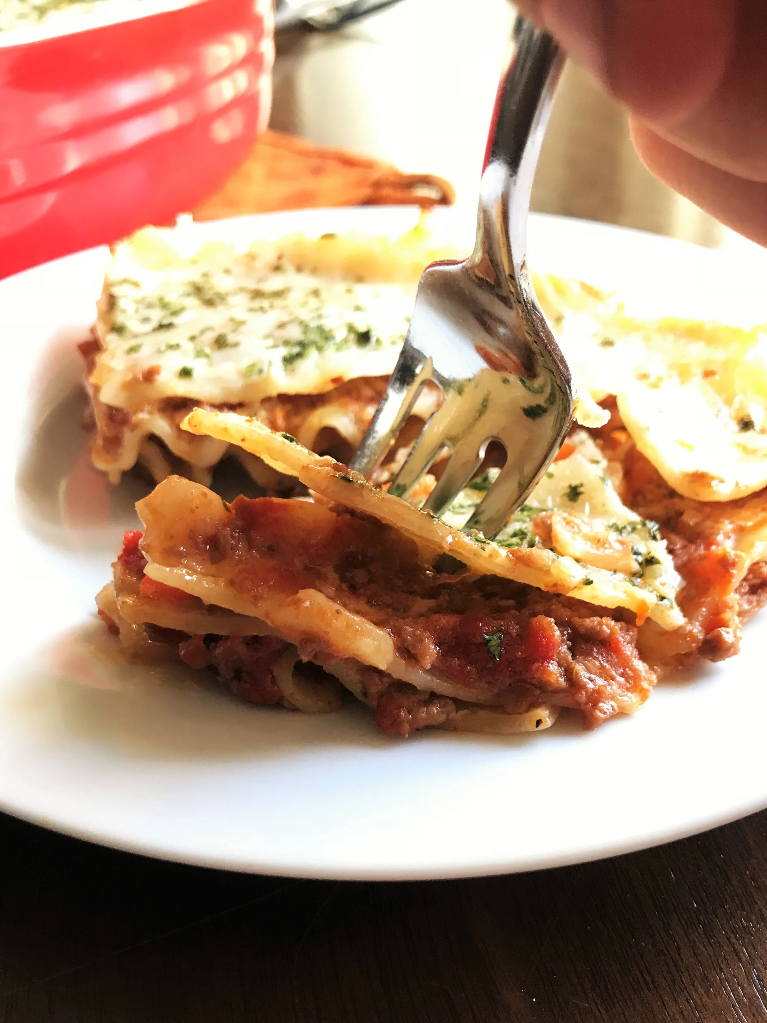 Digging in to that Classic Lasagna. The layers, the pasta, the Parmesan, the creamy goodness, the meaty deliciousness.... My oh my.