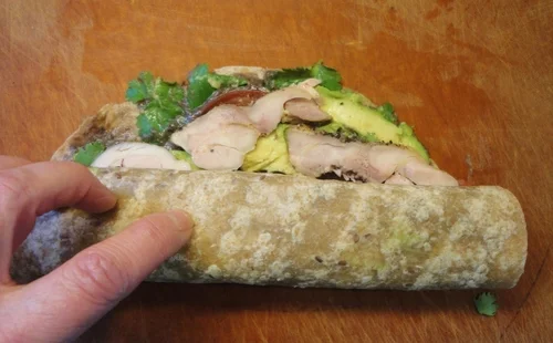 As you roll tightly, the ingredients will squish toward the far end.