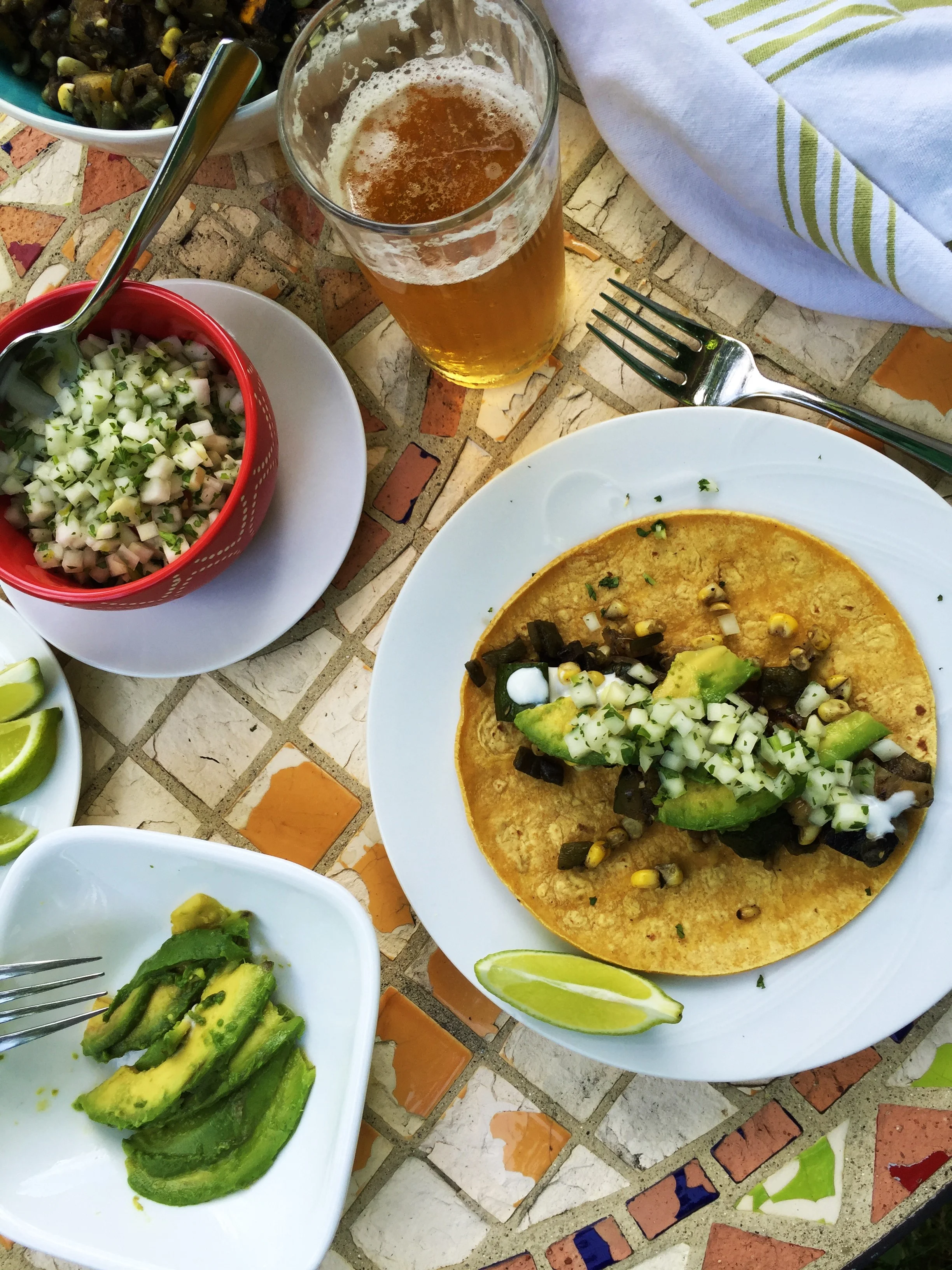 Mostly Plants vegetarian taco party in the Adventure Kitchen! Grilled Summer Veggie Tacos with Kohlrabi Salsa Cruda , Mexican crema and avocados. Serve with Mexican-style beans on the side and Hibiscus-Mint Lime Spice Pops for dessert, and you've got a real feast, my friend.
