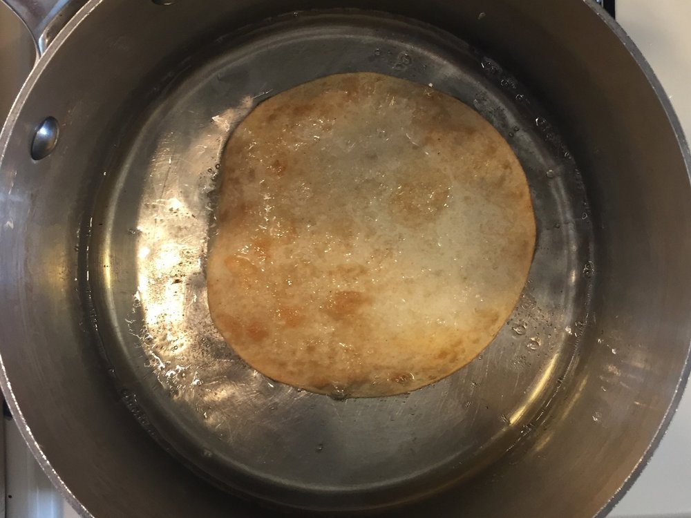 Tortilla has been turned, is nearly done.