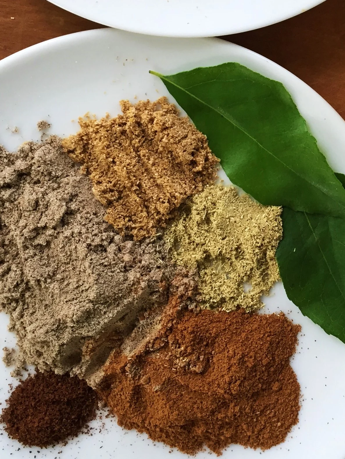 Combine the spices together to add with the curry leaves all at once. They’ll splatter a lot, so use the pot lid to protect yourself.