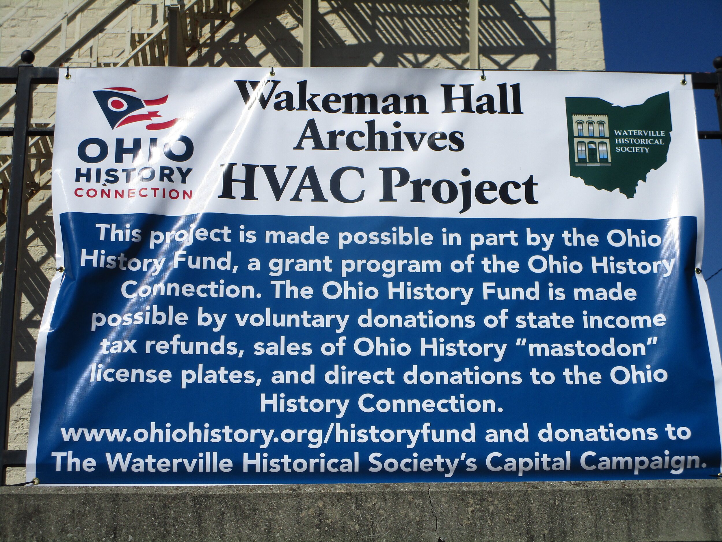 Large banner annoucing air conditioner replacement project partialy funded by Ohio History Fund 9-16-2021.JPG