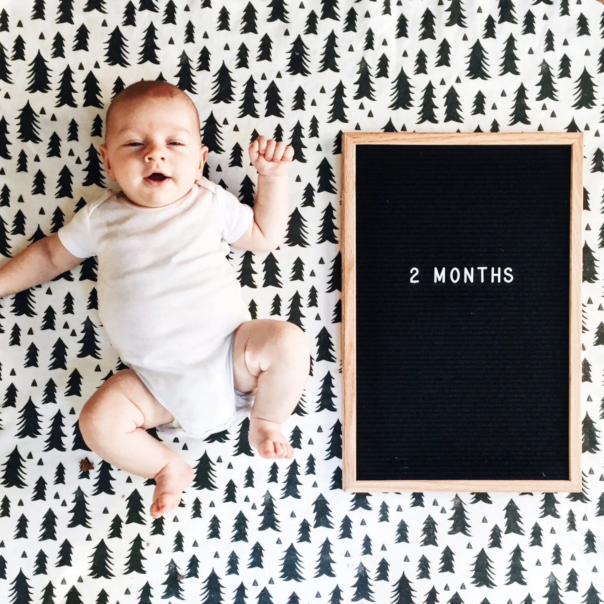 Look at those leg rolls! This little guy is a champ – in the 95th percentile in height and weight (but in the 100th percentile in cuteness); I cracked into his 3-6 month clothes 2 weeks ago. His need for speed is still going strong- doing baby crunches and standing up with our help all day long! He's still working on finding his thumb, but who really needs to when you can practically fit your whole fist in your mouth. And he's also moved on to chewing and drooling on everything!! He's so smiley and interactive and has the sweetest baby voice. He loves music and can be entertained by mommy's dance moves for the longest time. And he'll start "goooing" along with you when you sing to him, like he's trying to join in on the song. His favorite place to be this month is dangled over daddy's shoulder – can't climb any higher when you've reached the summit . He's such a happy little guy – but he'll make you work for it! (All I've got to say is, David and I won't be needing to join a gym anytime soon.) But the best update of ALL is how much he lovesss the Trololo song! (If you haven't heard it, look up "Trololo Guy" on YouTube - just don't blame me if you have weird dreams tonight...) The tune never fails to bring a smile even in the midst of a meltdown. I was for sure singing it when I took this photo! All my days are yours. I love you.