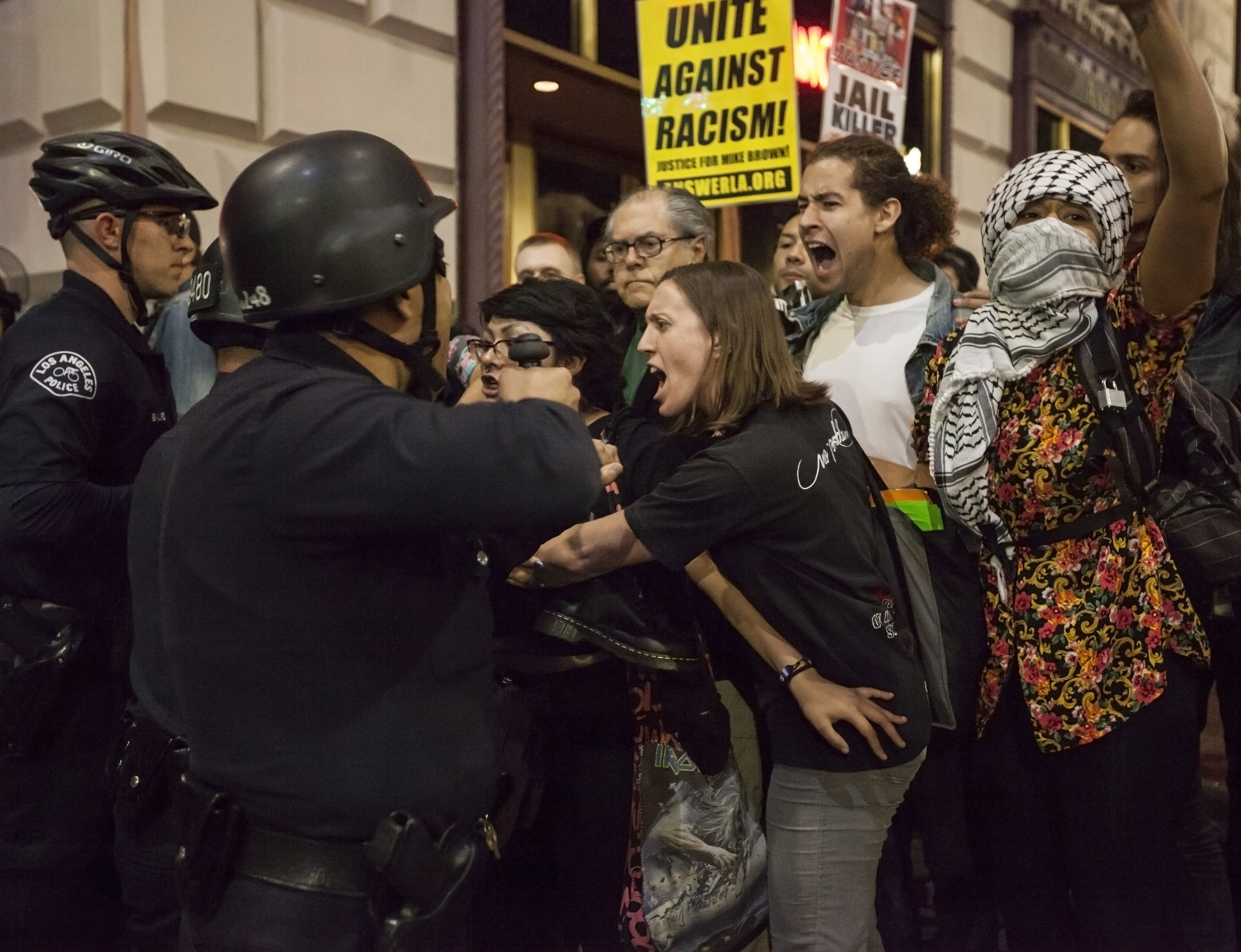  Emotions ran high between police and protesters during a rally in support of Mike Brown. LAPD officers created a bottleneck by blocking protesters with nowhere to exit. Soon after being blocked, the LAPD gave the protesters a four minute warning to 