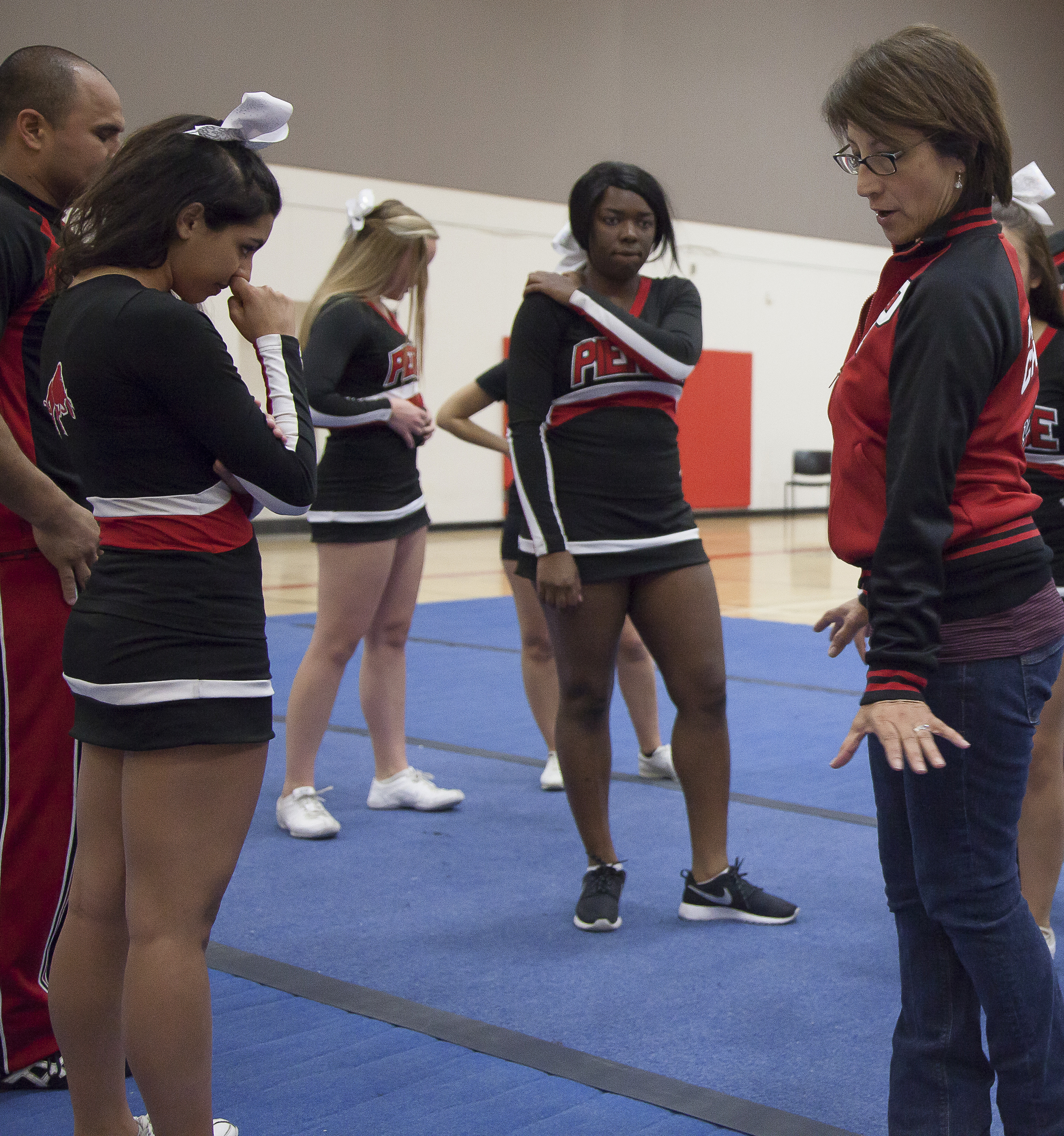  Coach Jenny Ghiglia goes over the routine while team members look on during a practice session in the North Gym on Sunday March 1, 2015. Woodland Hills, Calif.  Read the full story&nbsp; here  