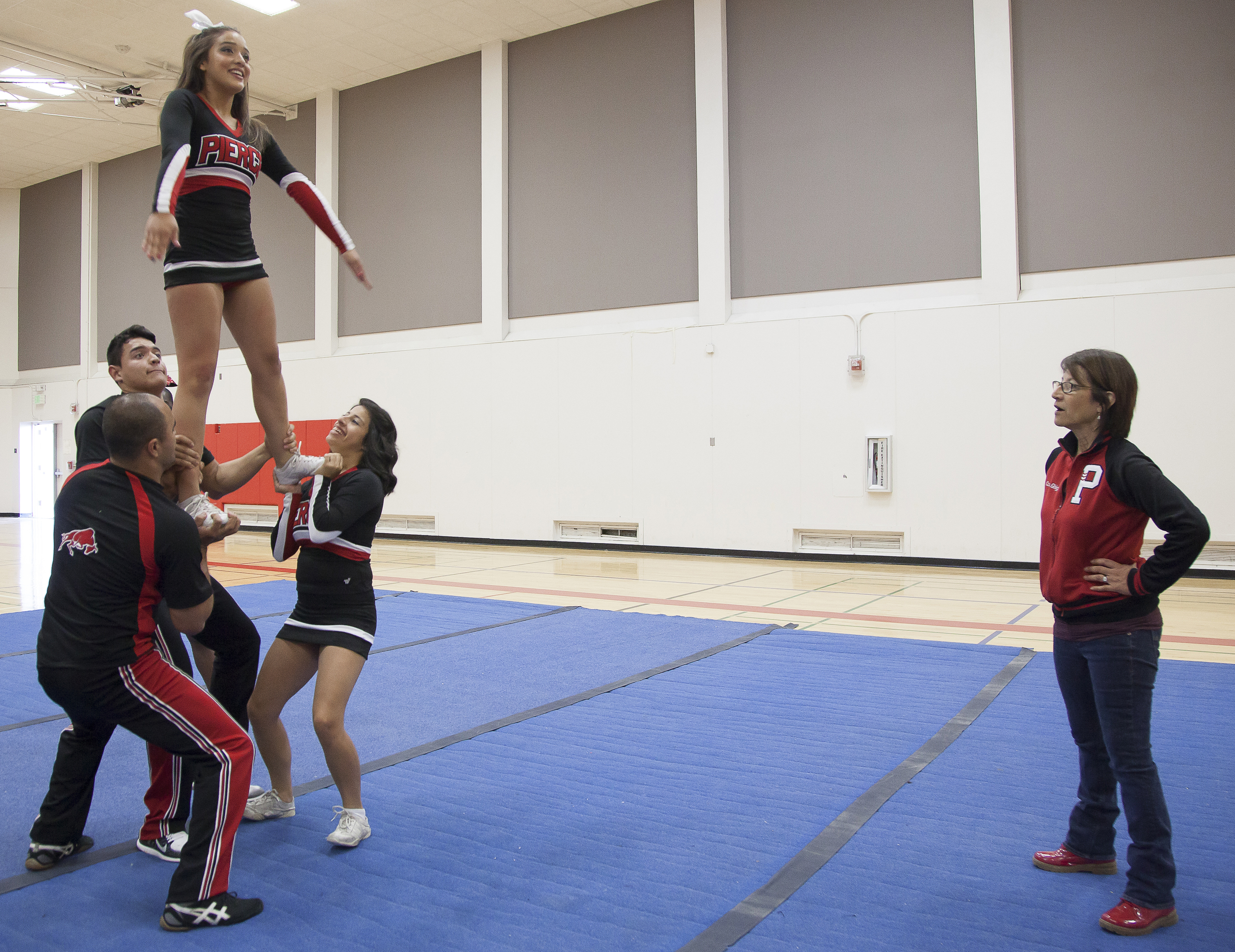  Coach Jenny Ghiglia watches&nbsp;as members of the Pierce Cheer Competition team perform a maneuver called a "full up" during a practice session in the North Gym on Sunday March 1, 2015. Woodland Hills, Calif.  Read the full story&nbsp; here  