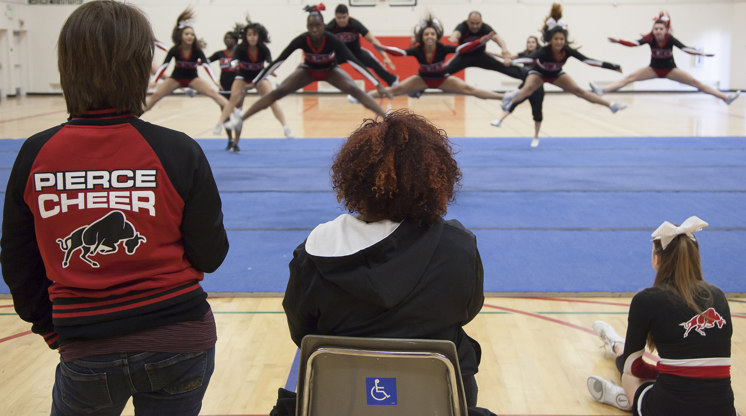  From left to right: Coach Jenny Ghiglia, Jordyn Lett and Katie Kucera watch as other members perform their routine inside the North Gym of Pierce College on Sunday March 1, 2015. Woodland Hills, Calif.  Read the full story&nbsp; here  