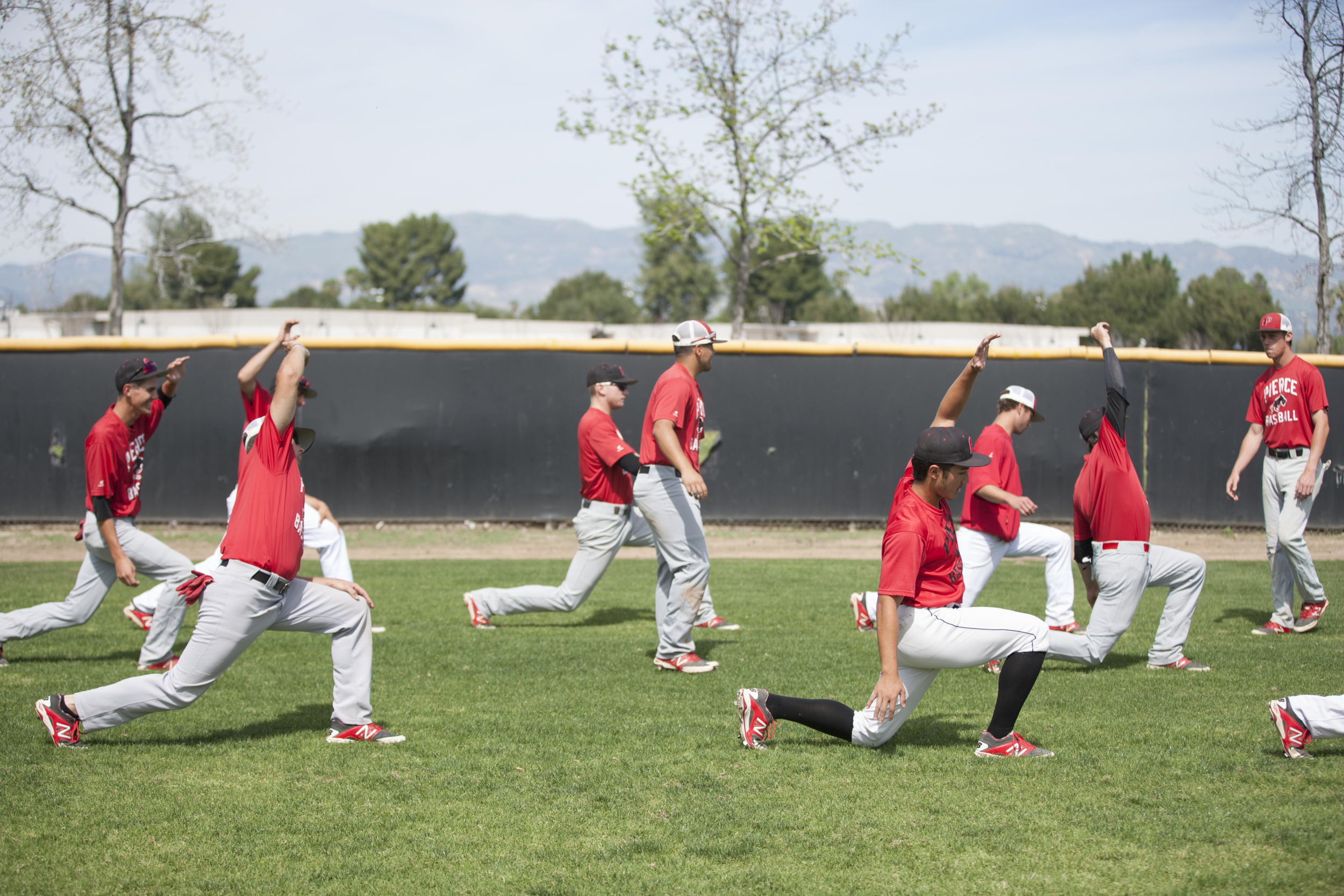  Members of Pierce College's baseball team stretch at Joe Kelly Field before practice on Tuesday, March 10, 2015. Woodland Hills, Calif.  Read the full story&nbsp; here  