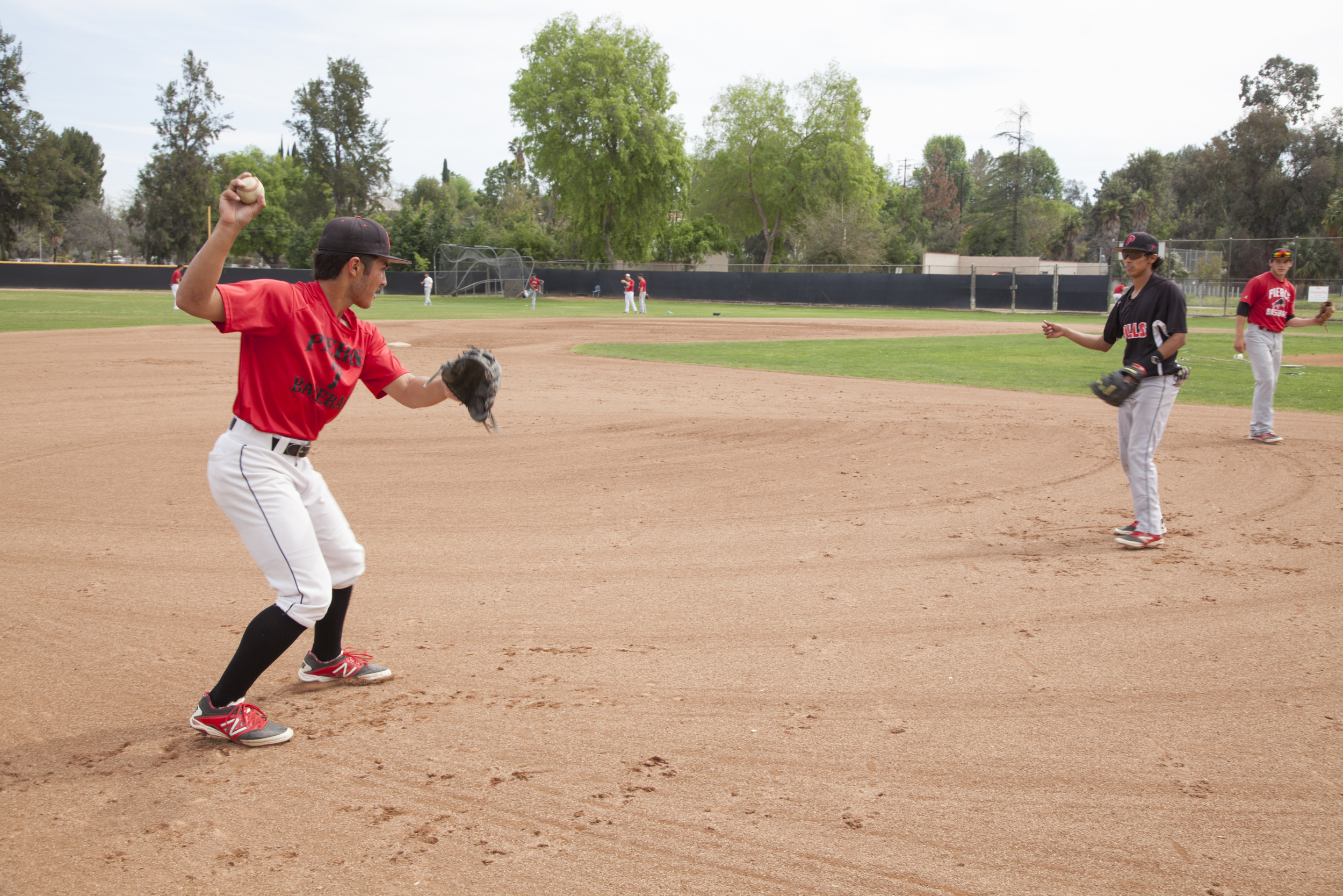  Jordan Abushala and Angel Cruz pair up to perform fielding plays at Joe Kelly Field on Tuesday, March 10, 2015. Woodland Hills, Calif.  Read the full story&nbsp; here  