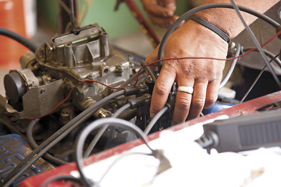  Lloyd Bryant carefully places a carburetor inside a 1968 Ford V8 engine before starting its ignition on Tuesday, May 5, 2015. Woodland Hills, Calif.  Read the full story&nbsp; here  
