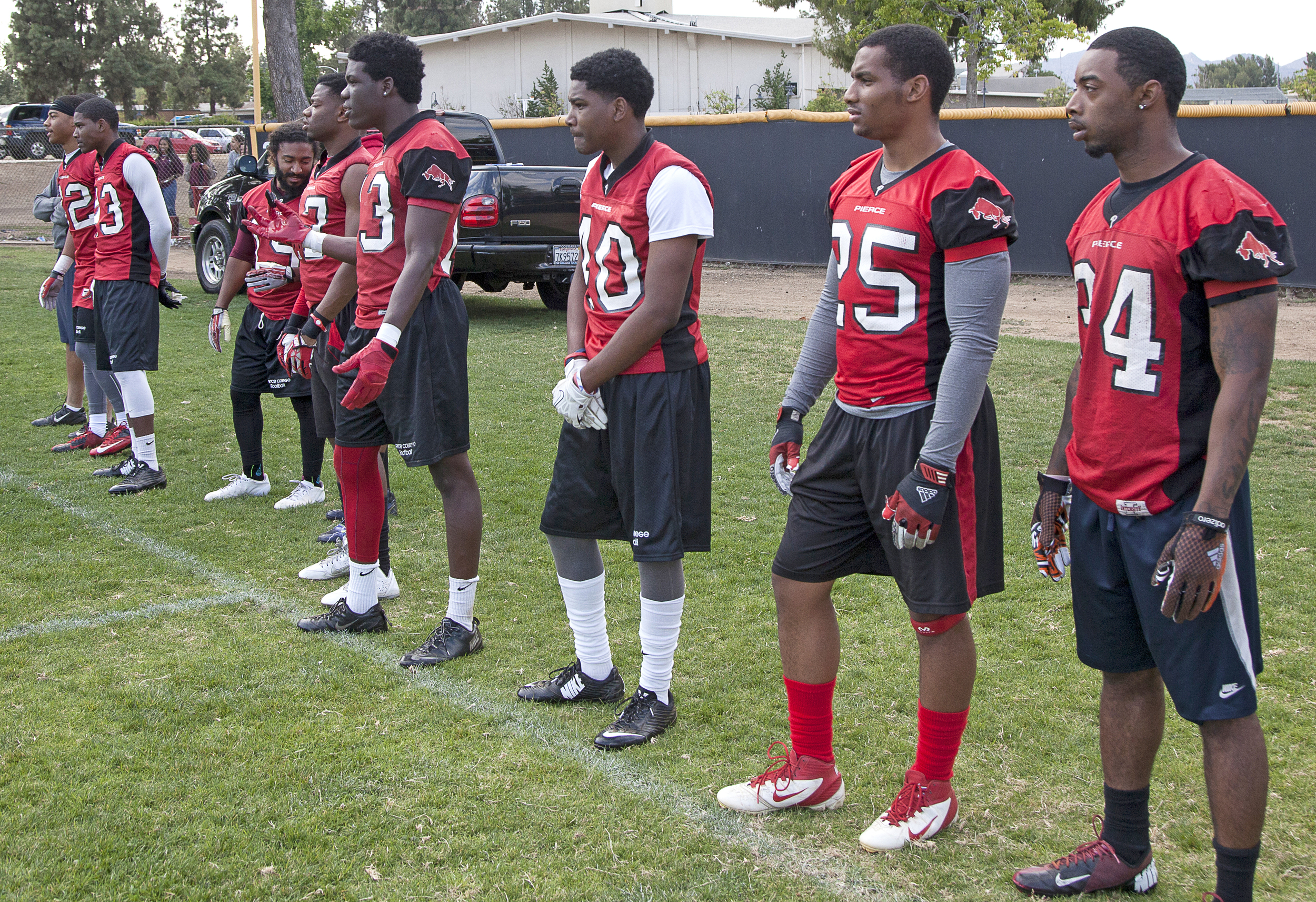  The defensive team observe from the sidelines as the offensive and defensive team scrimmage during an offseason spring practice session on Thursday, May 21, 2015. Woodland Hills, Calif.&nbsp; 