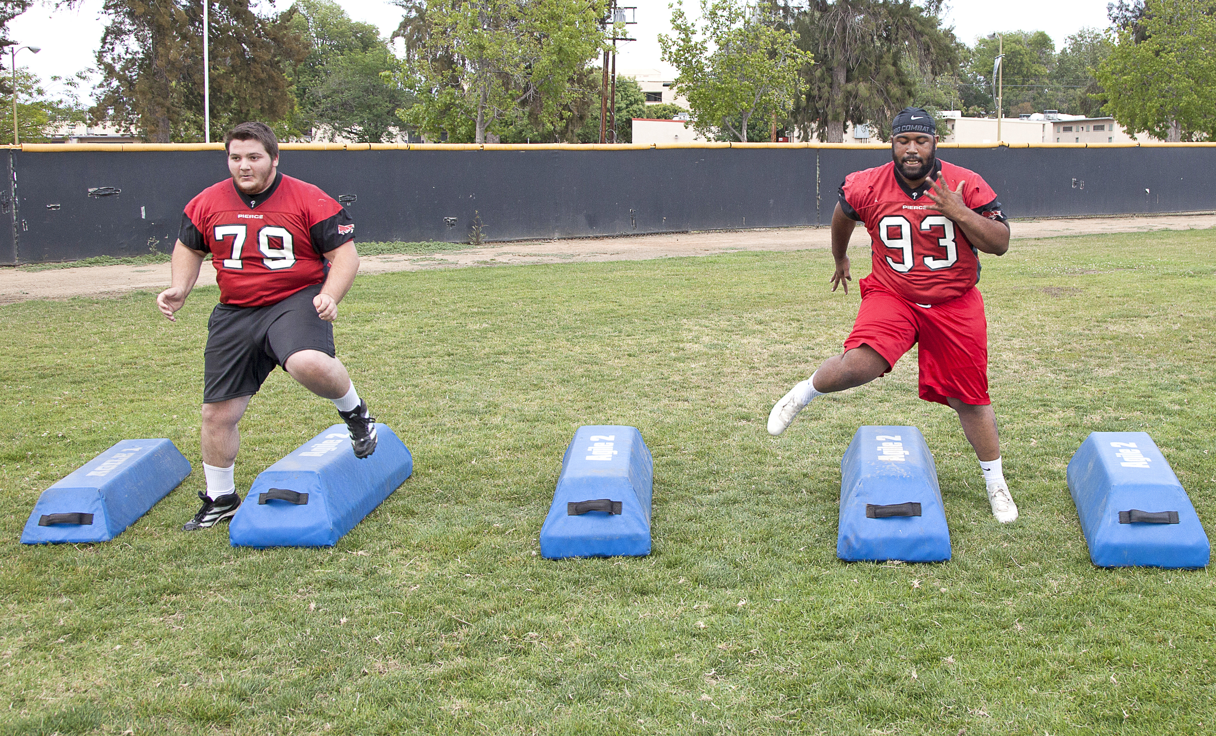  Defensive tackles Sean Grogan and Timothy Clock work on their stamina and footwork during a spring practice and training session on Thursday, May 21, 2015. Woodland Hills, Calif.&nbsp; 