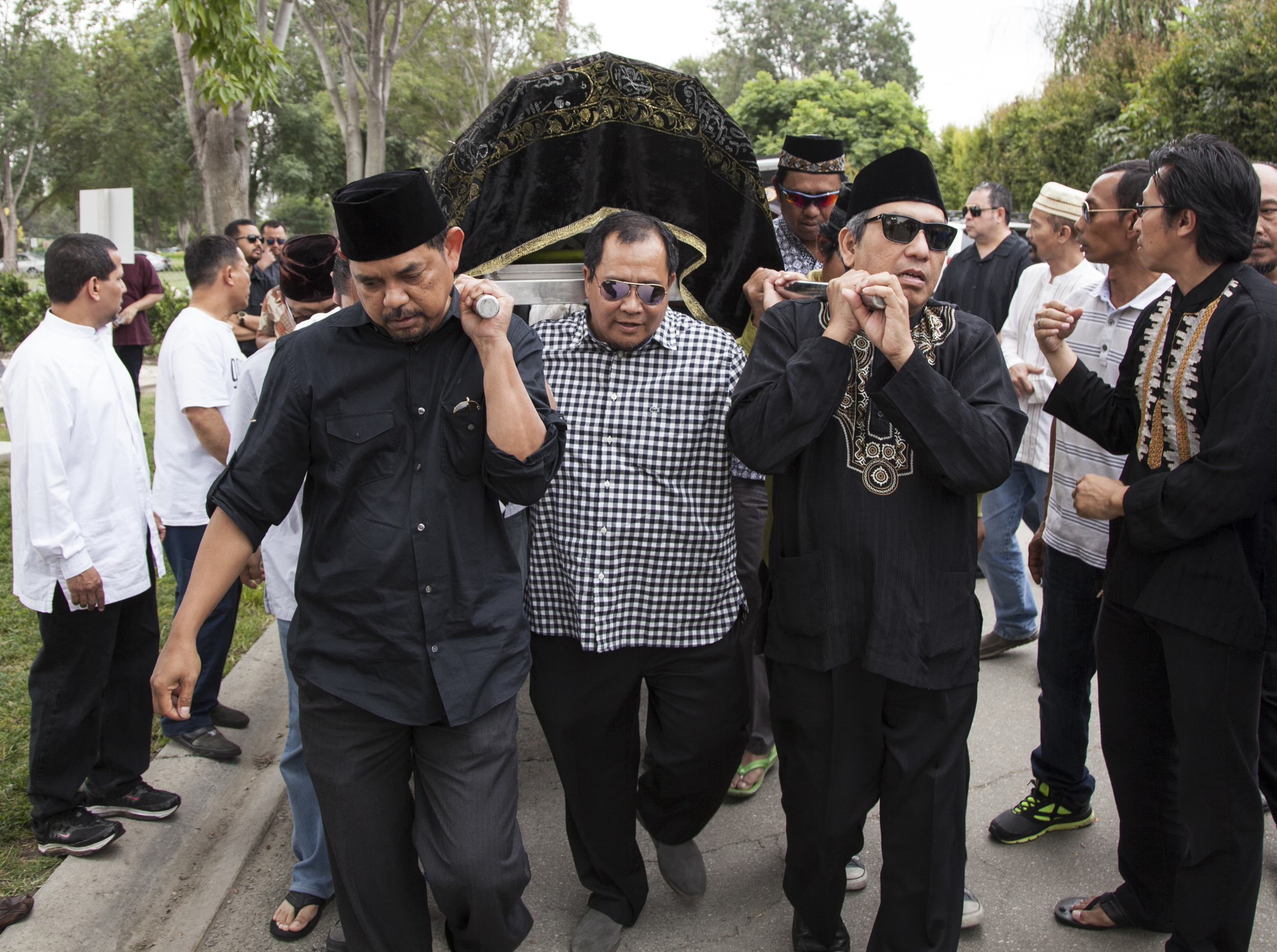  Friends of my father help carry his body to his final resting place in Garden Grove, Calif. on&nbsp;Saturday, June 27, 2015. 