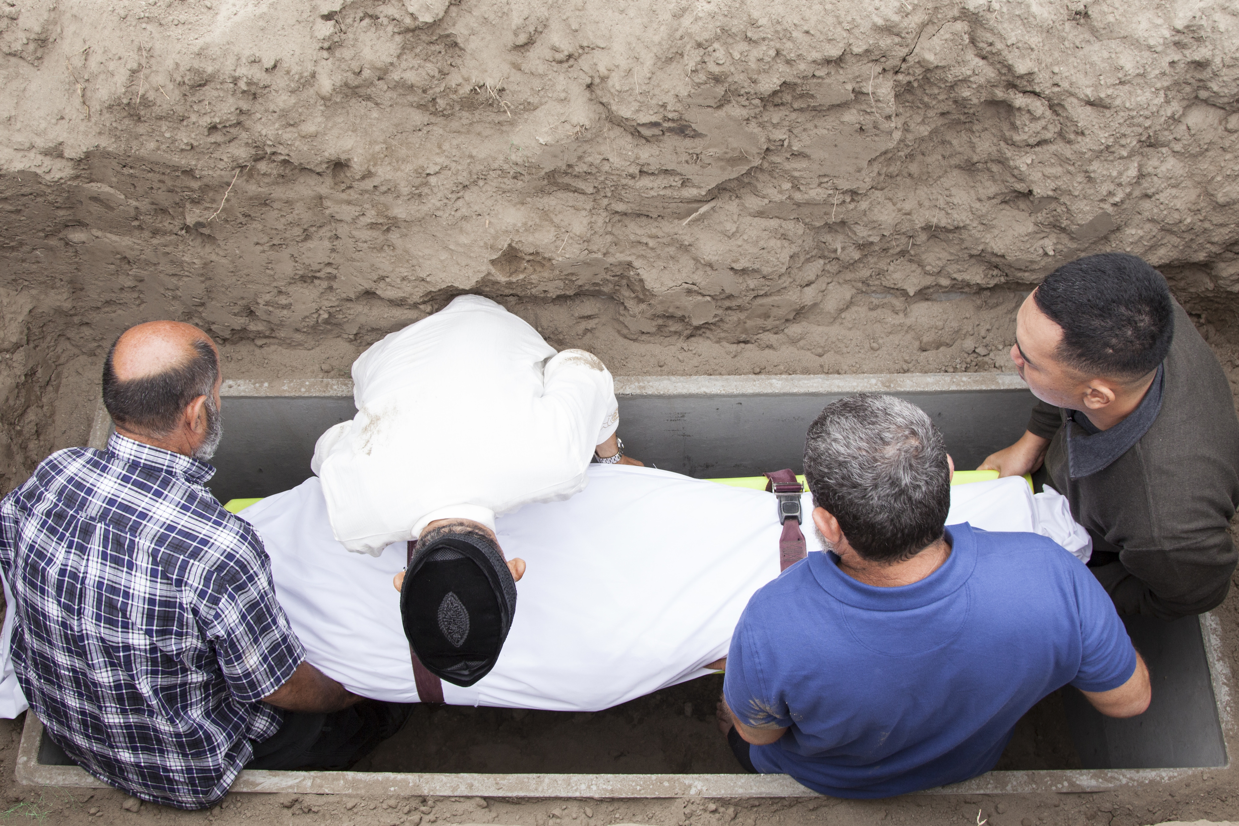  Friends and family members carefully lower my father's body into his grave on&nbsp;Saturday, June 27, 2015. Garden Grove, Calif. 