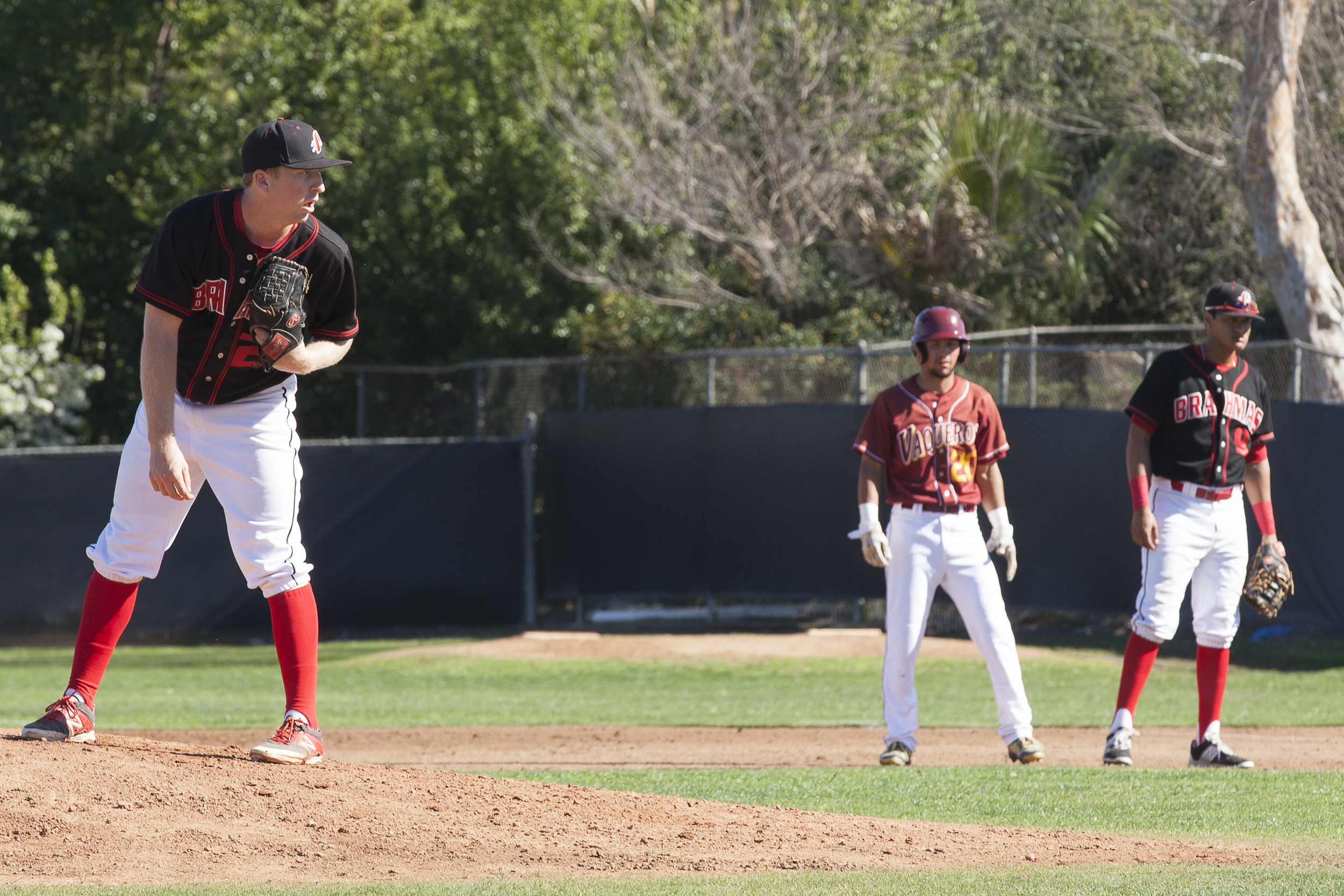  With a runner on 1st base, Brett Weisberg set his feet before throwing a pitch during a home game in Woodland Hills, Calif., against Glendale College on Saturday, Feb. 13, 2016. Glendale would win the game with a score of 15-6.&nbsp; 