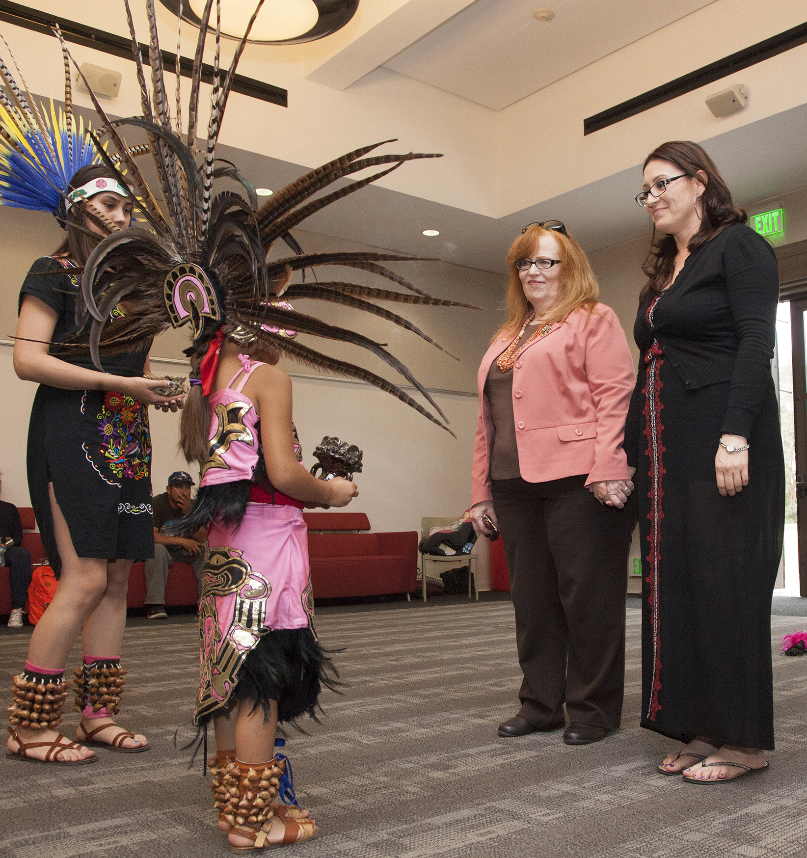  Vallerie Flores prepares to bless Pierce College President Kathleen Burke, center left, and Angelita Rovero, professor of Chicano Studies, center right, in an Aztec ritual during the 1st Annual Cinco de Mayo Celebration inside The Great Hall in Wood