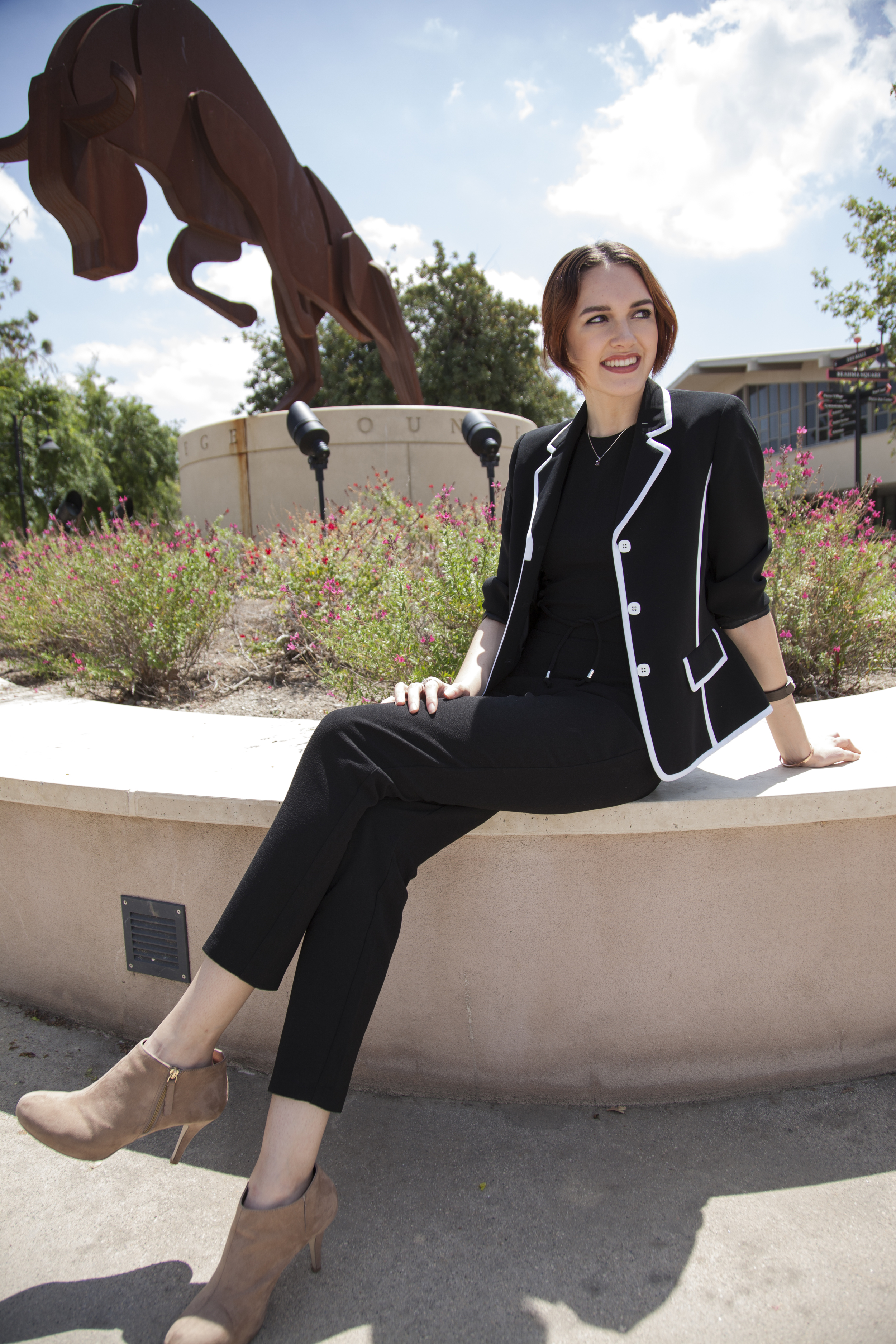  Jamie Daugherty, a 21-year-old communications major, has appeared on shows such as Girls Rock, Luscious Waves, Coco Rocha, and FAB Life. Daugherty sits in front of the Bull sculpture on The Mall of Pierce College on Wednesday, April 20, 2016 in Wood