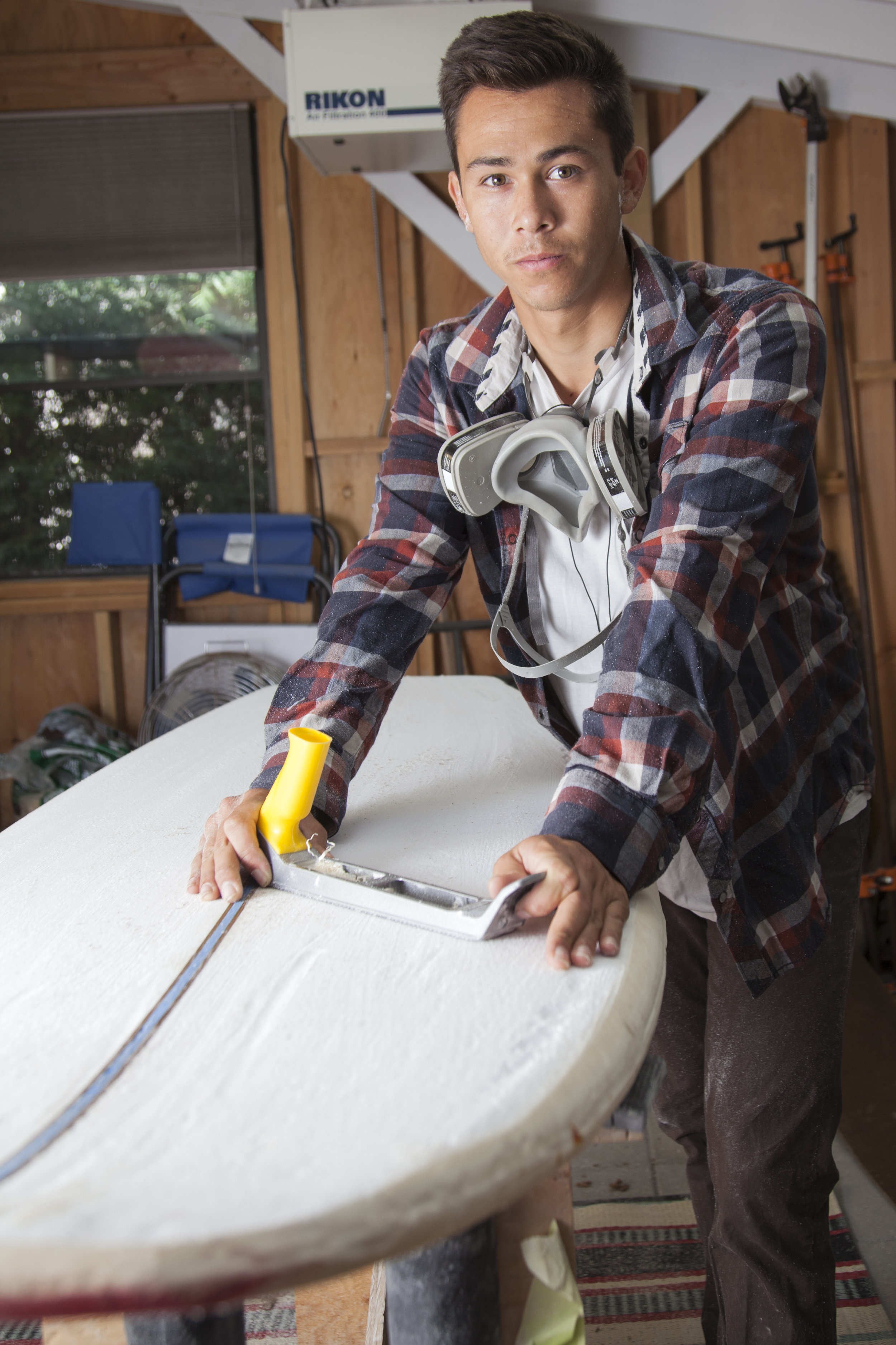  Kieran Giffen works on a custom surfboard inside his workshop in the back yard of his home in Woodland Hills, Calif. on Tuesday, Oct. 4, 2016. Giffen began shaping custom surfboards for his friends when he was 13, but now Giffen receives offers from