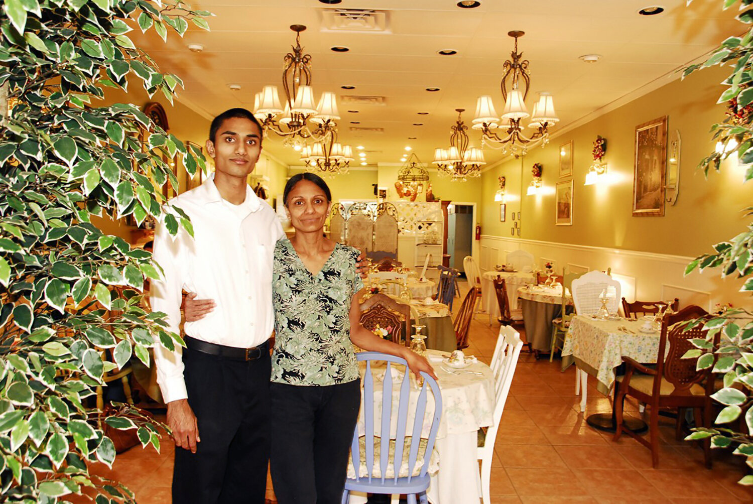  Shika with her son Hemal in front of the dining room. 