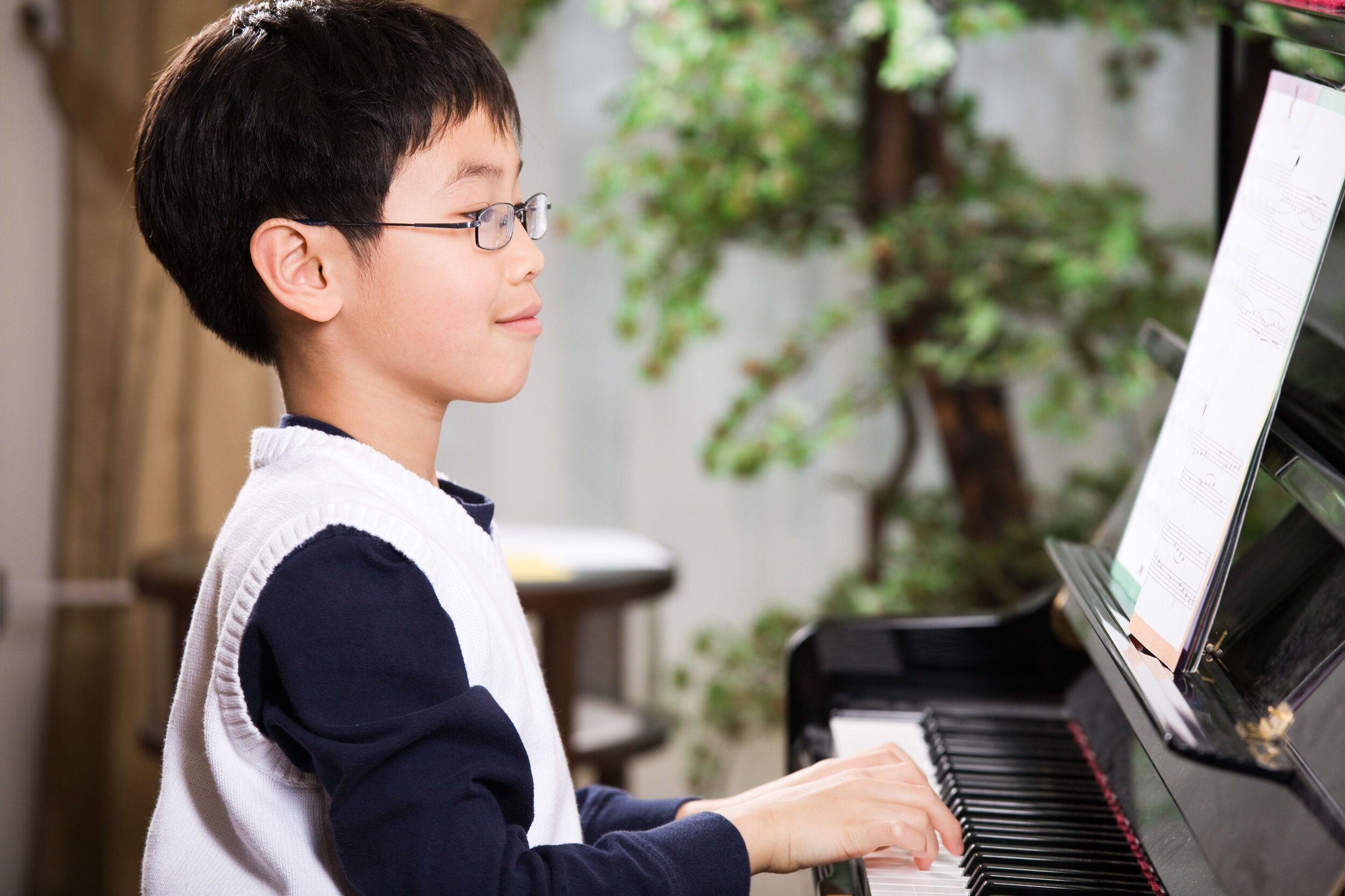 Child taking piano lessons