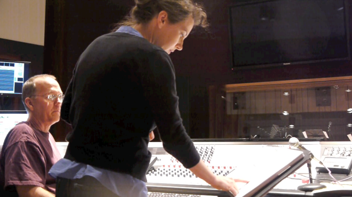 Joan at controls in studio.png