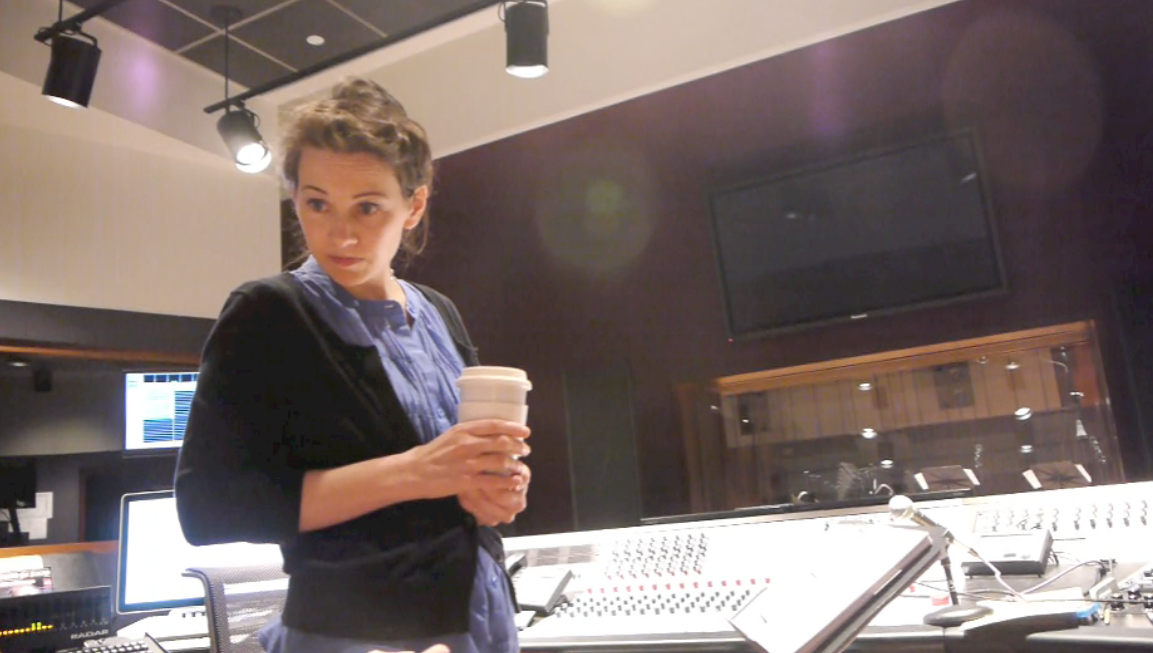Joan with tea in mix booth.png