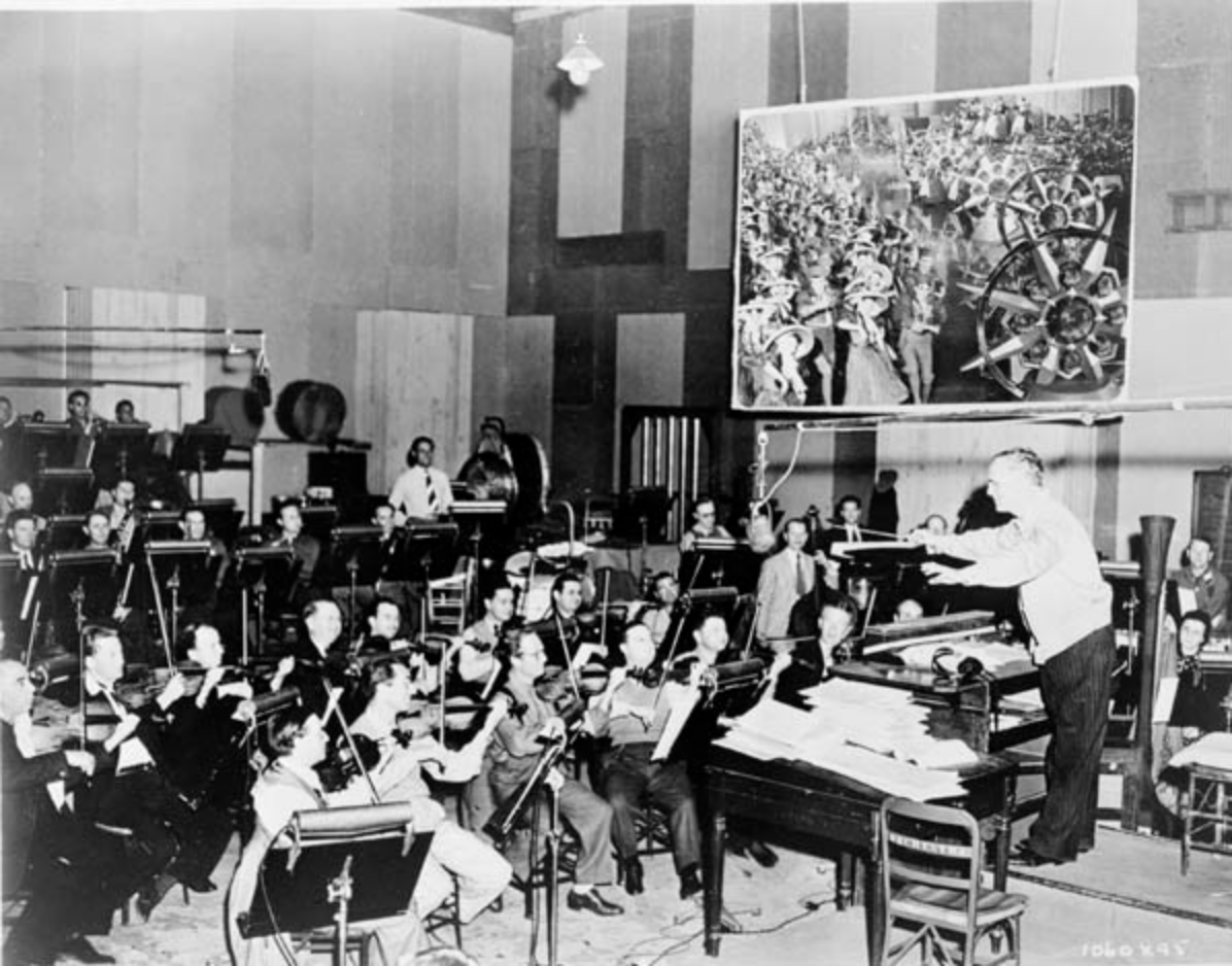 The MGM Studio Orchestra recording music for The Wizard of Oz. Note the plywood walls.