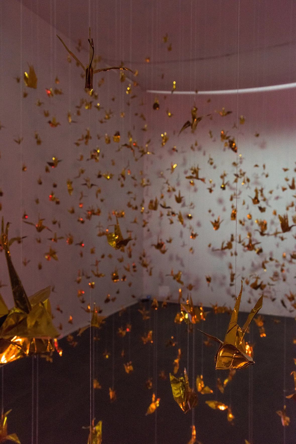 Isabelle Harada W=Fd , 2016 Variable dimensions 999 foil origami cranes, thread, mylar gels