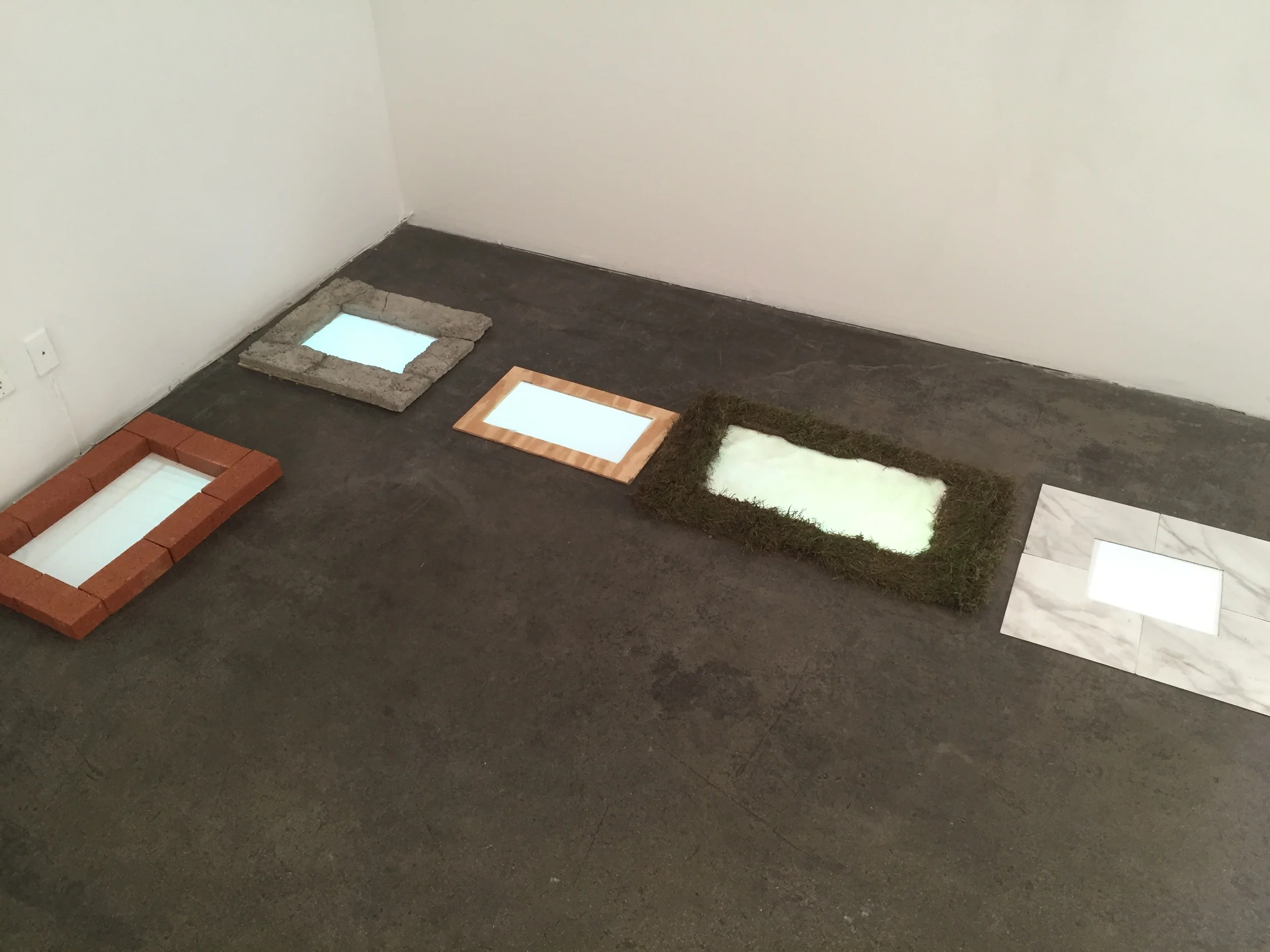 Isabelle Harada Find your Feet , 2016 5 channel video installation oncrete, wood, brick, sod, linoleum, projection Variable arrangement