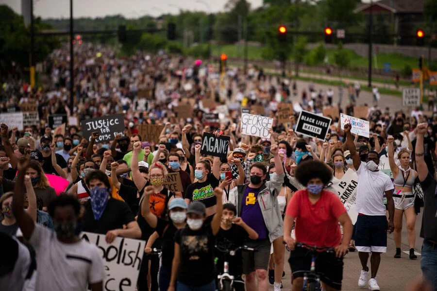 Protesters march on Hiawatha Avenue while decrying the killing of George Floyd on May 26, 2020 in Minneapolis, Minnesota. (Photo credit: Stephen Maturen/Getty Images)