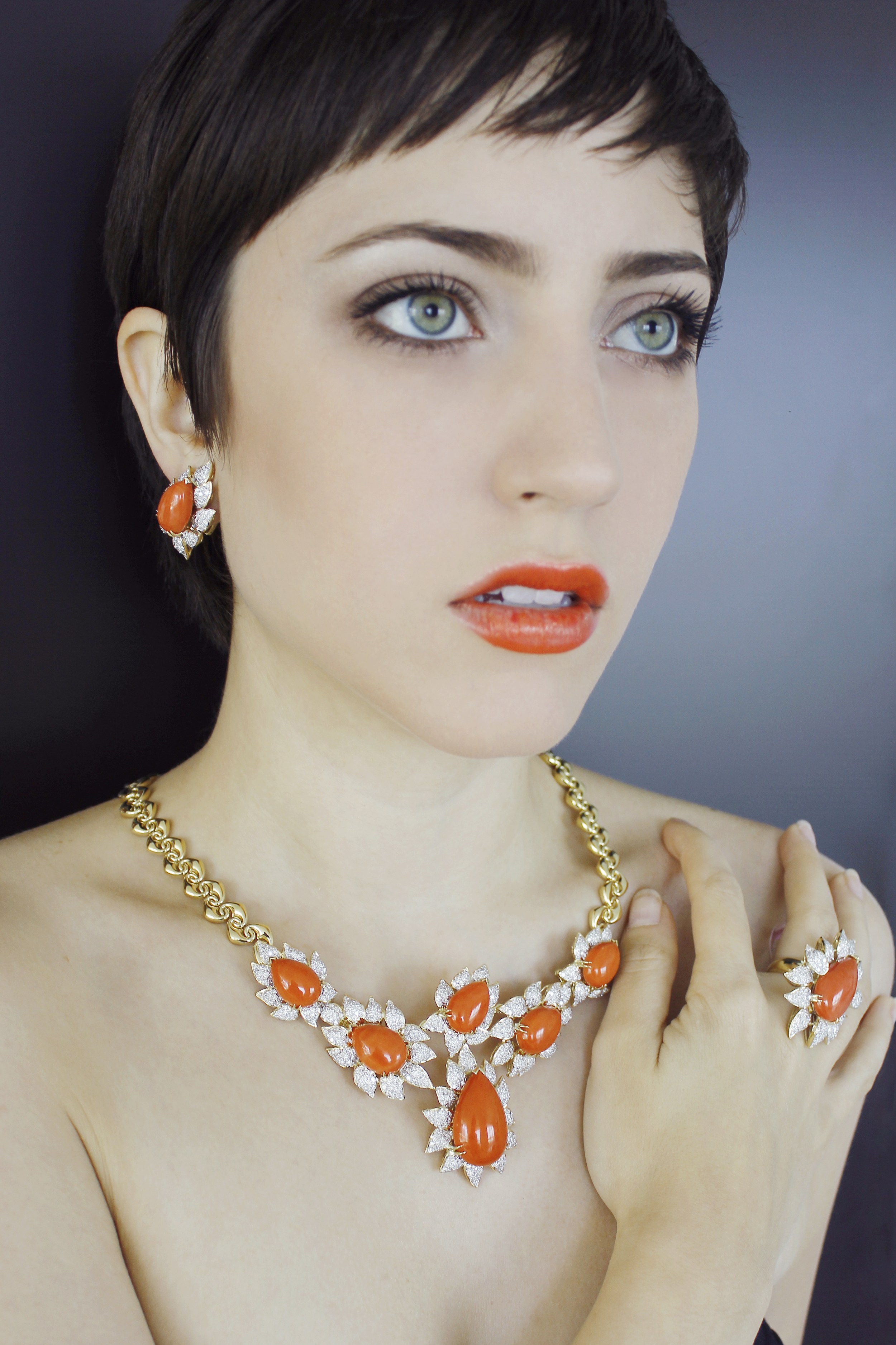 18 karat gold earring, ring, and necklace set with high quality coral