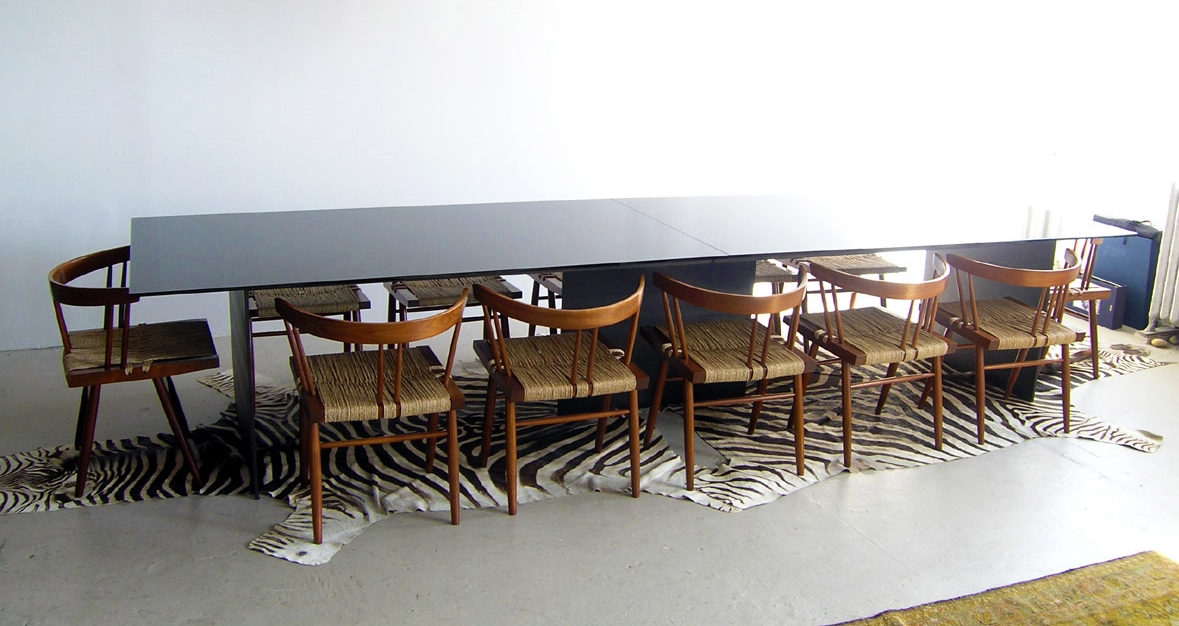 Custom dining table, black glass and steel (shown with original Nakashima dining chairs), 2010 .