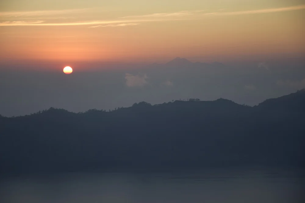  The sunrise from our view on Mt. Batur. We can see the island of Lombok in the distance. (Photo by Brian Law) 