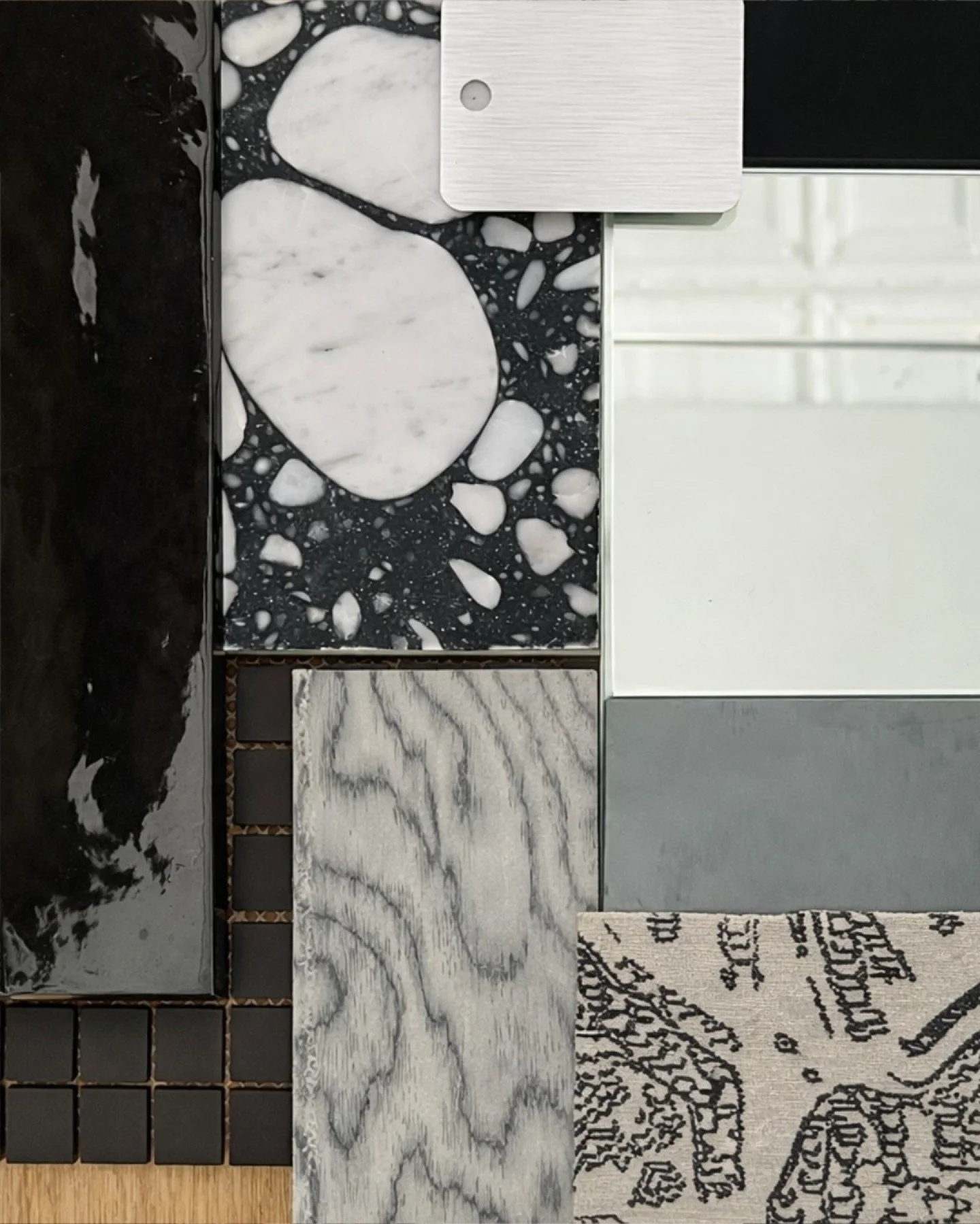 In our studio, we&rsquo;re always looking to create unexpected wow moments. This high-contrast black and white material palette is one example of that approach for a residential client. The bathroom, anchored by a custom stone shelf nook, becomes a b