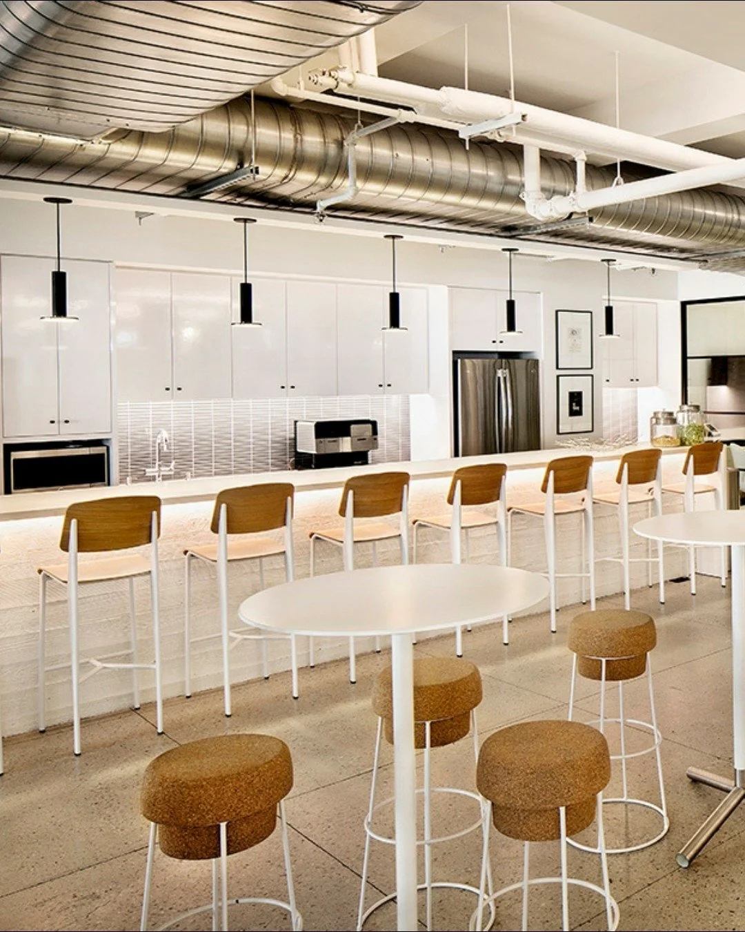 Form meets function (and a little bit of fizz).
Here's a look at cork kitchen stools we used in the Nike Communications' office cafe, a clever nod to their extensive roster of wine and spirits clients.